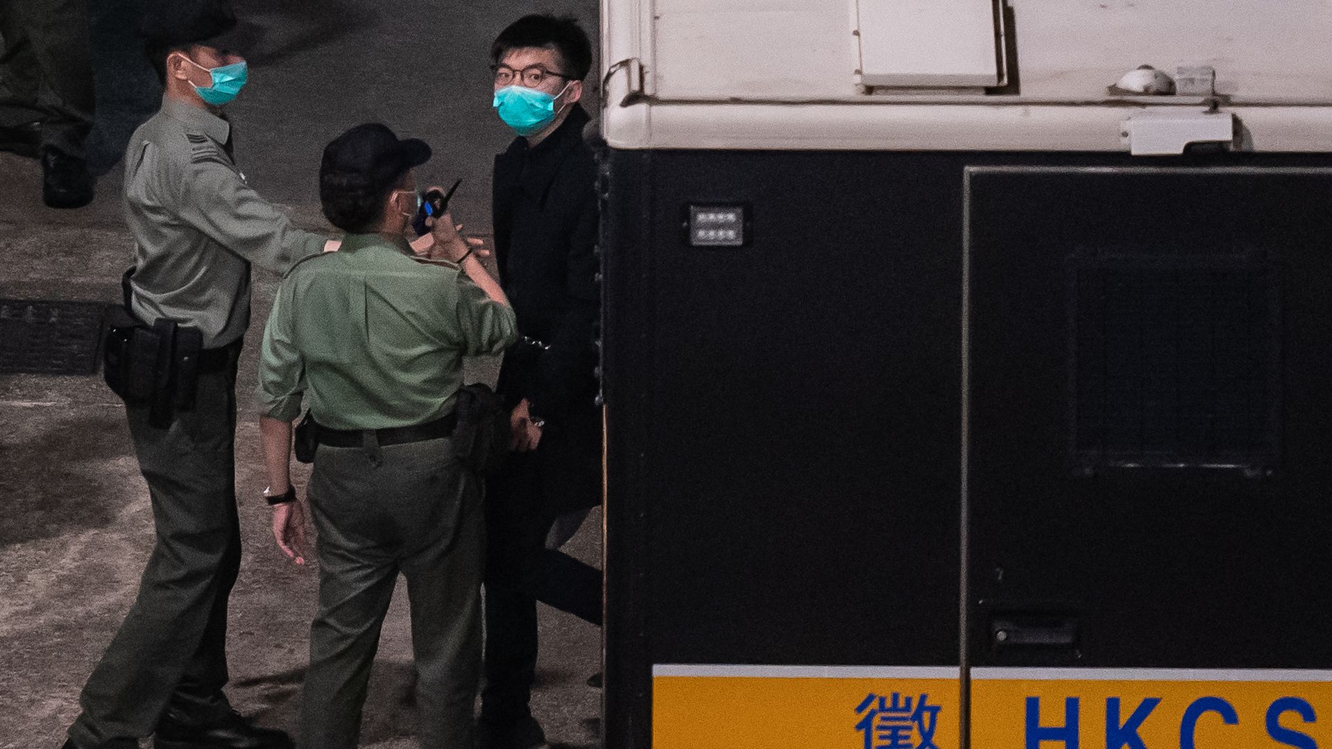 Pro-democracy activist Joshua Wong to exit a Correctional Service Department van at Lai Chi Kok Reception Centre after a court hearing at the West Kowloon court on March 2