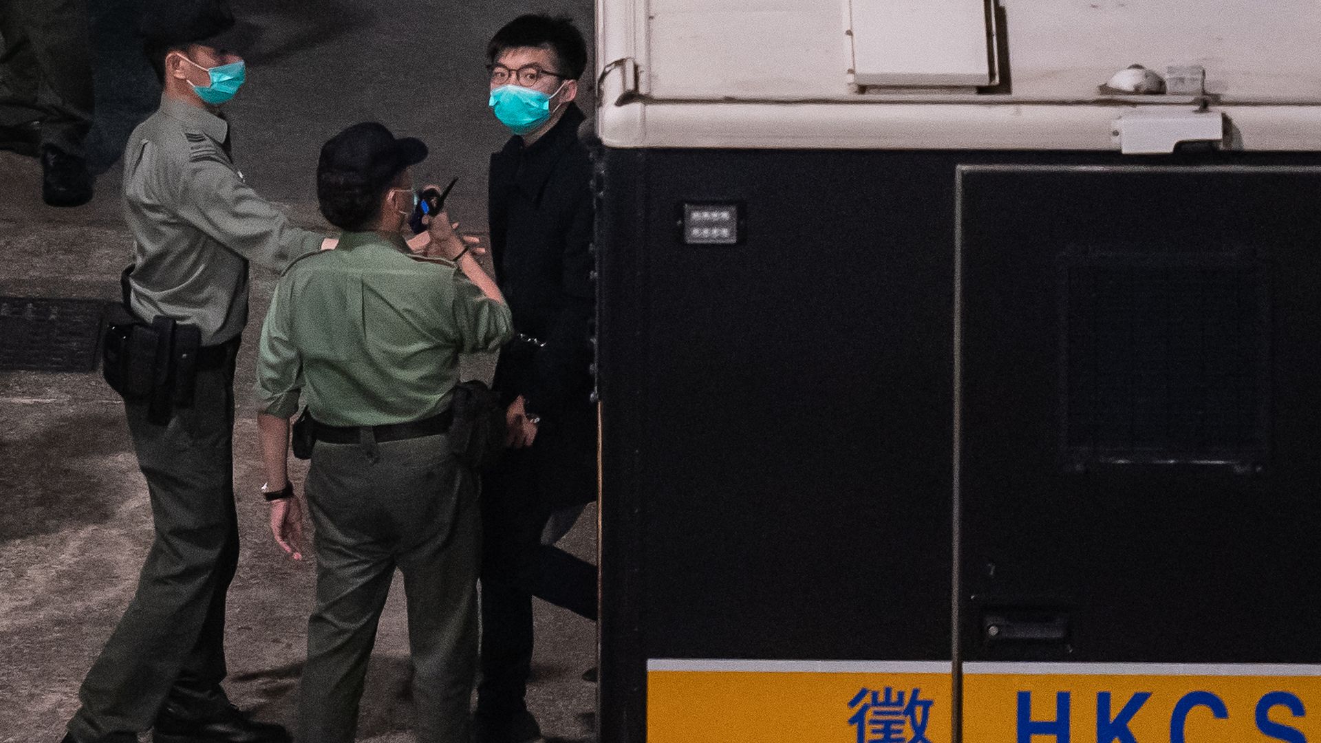 Pro-democracy activist Joshua Wong to exit a Correctional Service Department van at Lai Chi Kok Reception Centre after a court hearing at the West Kowloon court on March 2
