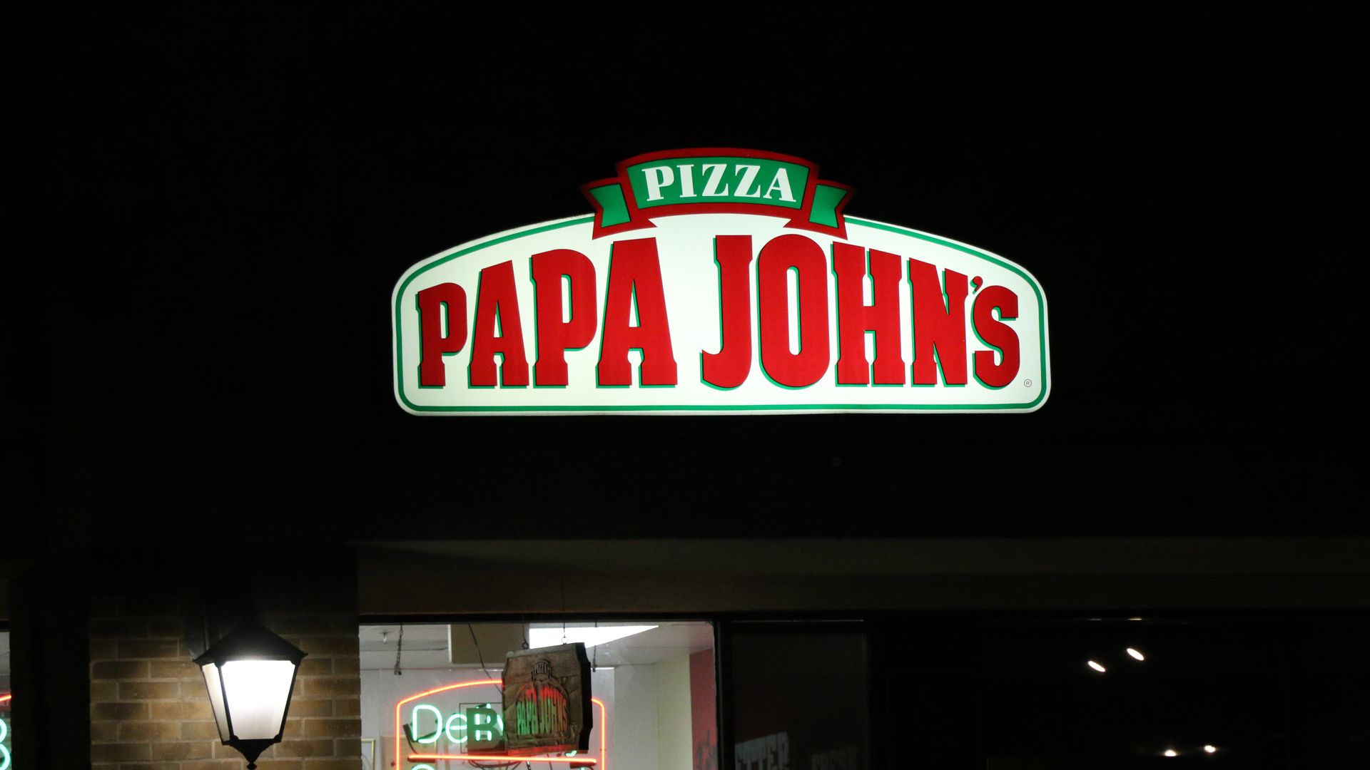 Neon sign of Papa John's pizza