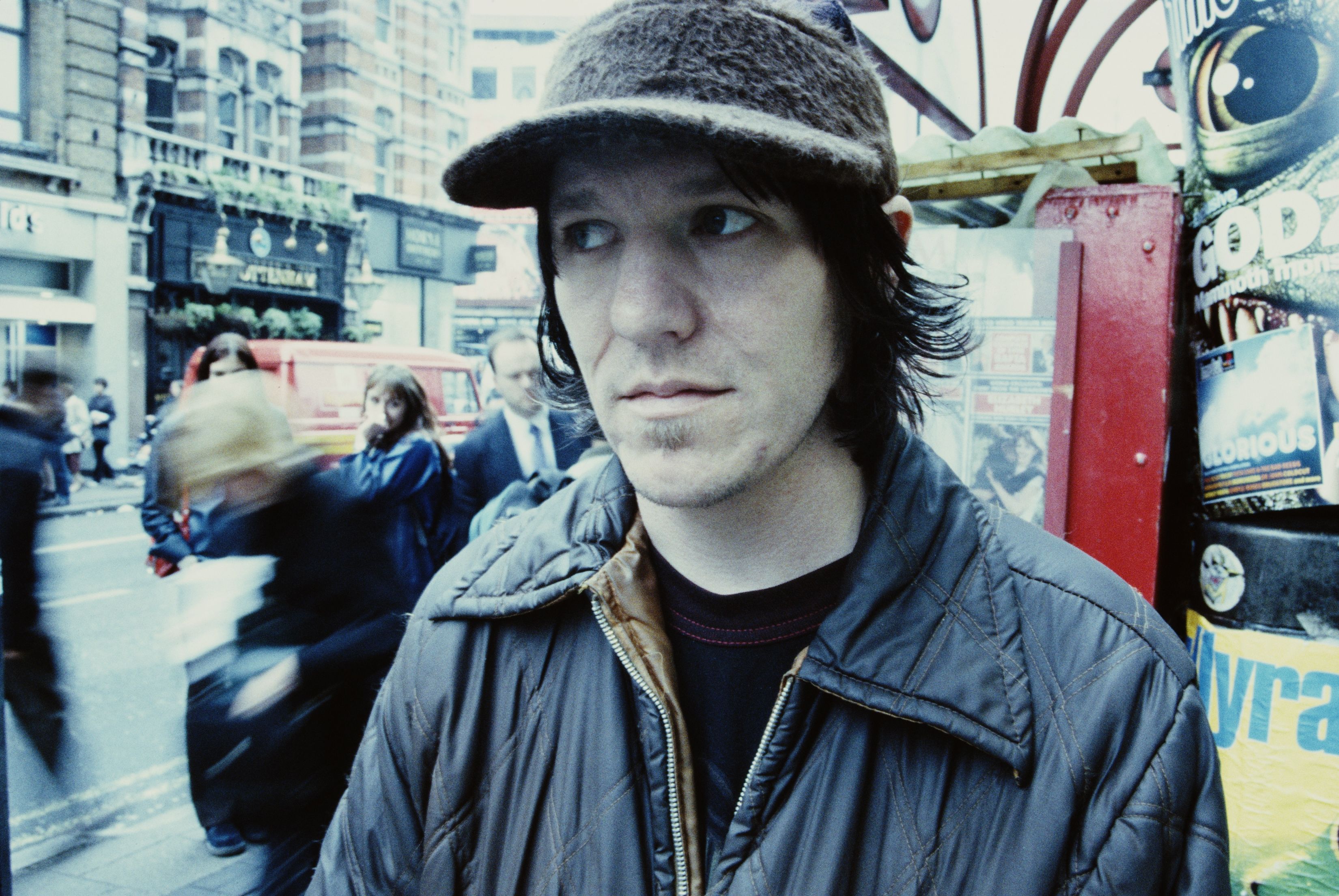 Elliott Smith poses for a photo on the streets.