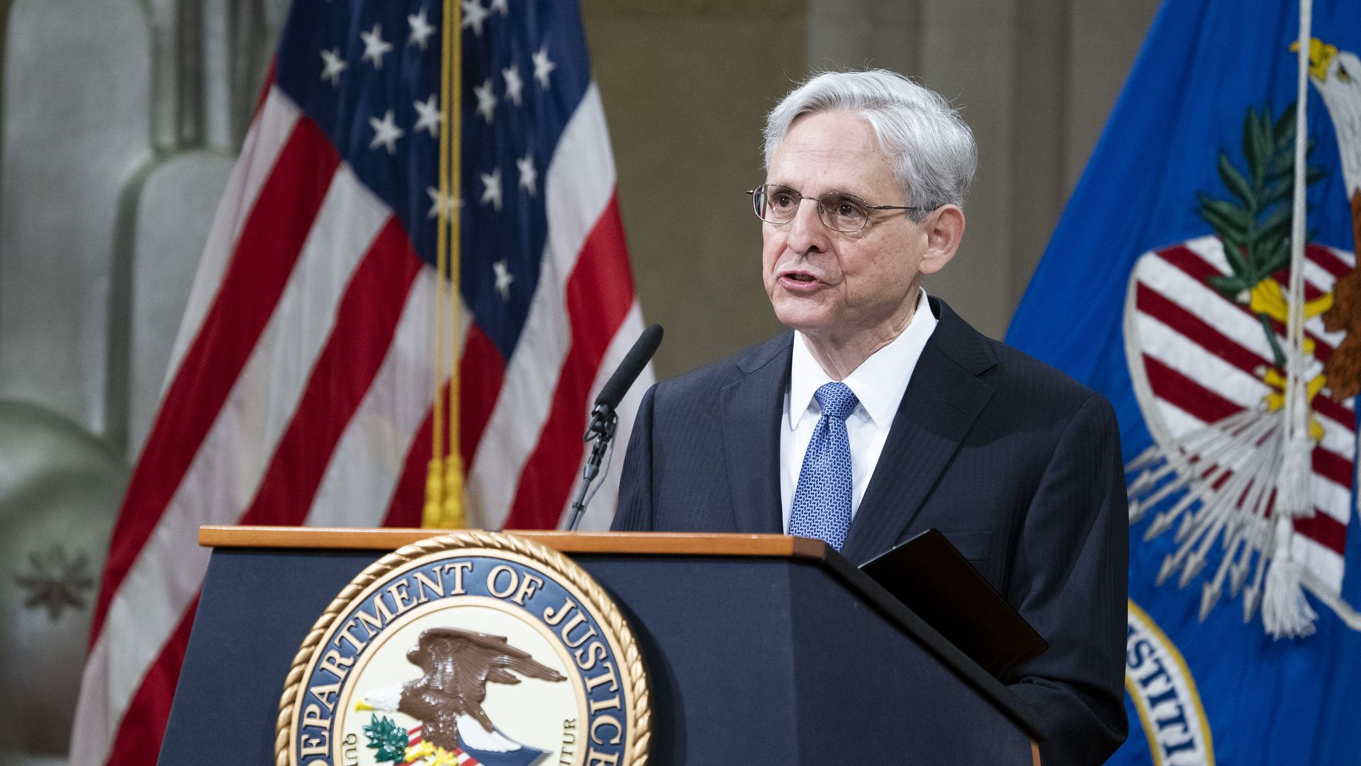 Photo of Merrick Garland speaking from behind a podium