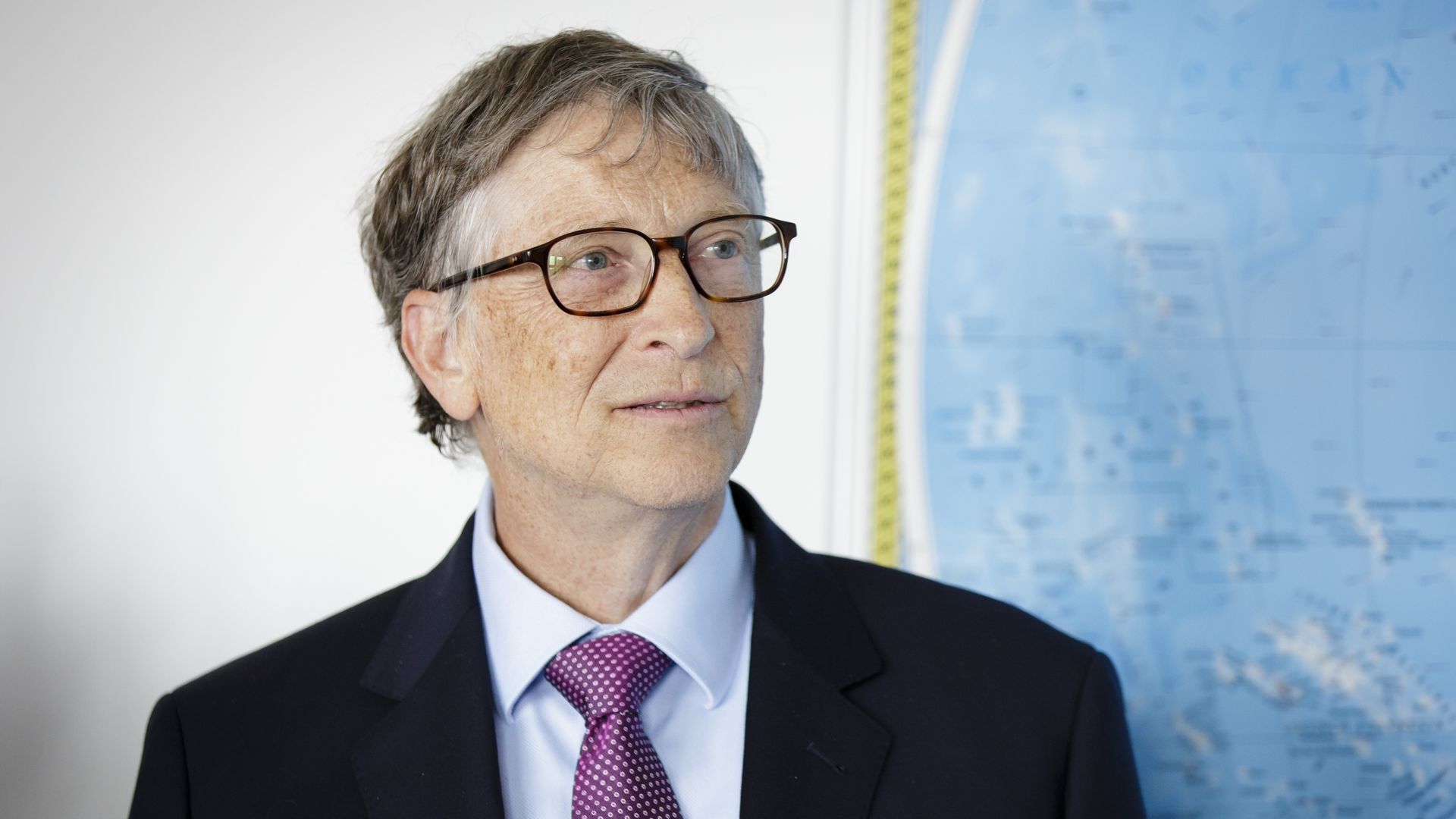 Bill Gates in front of map