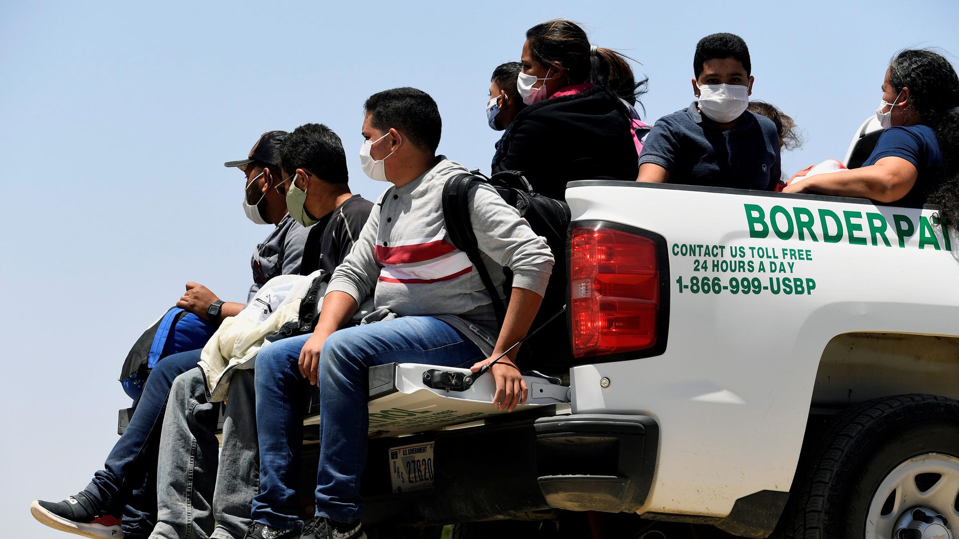 Migrants attempting to cross in to the U.S. from Mexico are detained by U.S. Customs and Border Protection at the border 