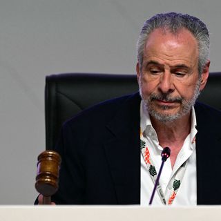 Fractious UN climate talks end with no direct push on fossil fuels in deal