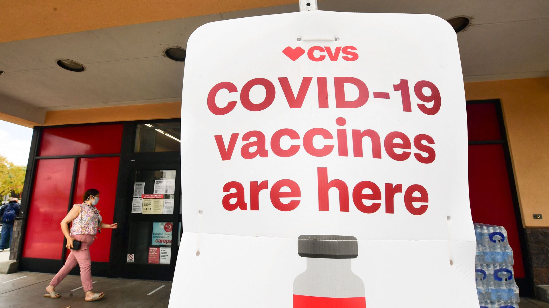 Photo of a CVS sign that says "COVID-19 vaccines are here"