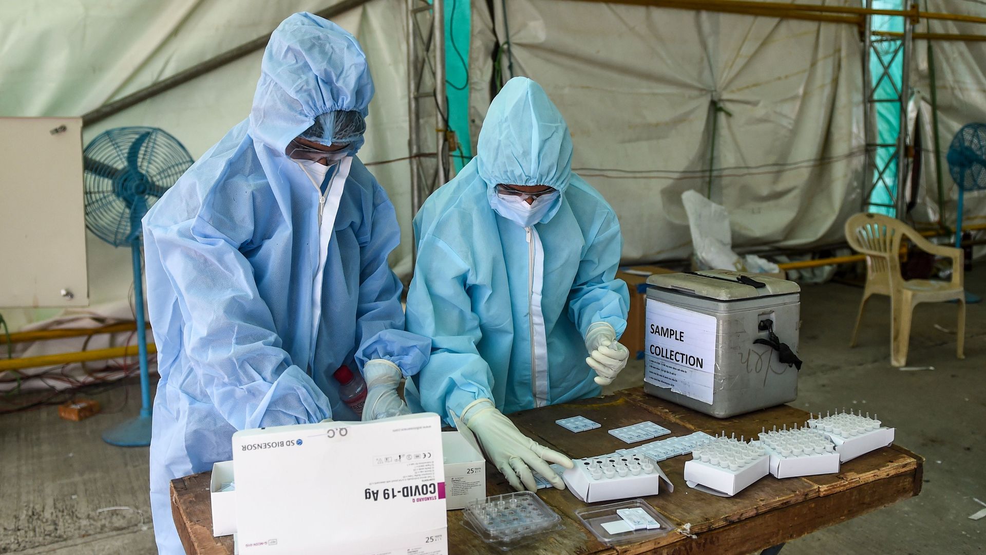 Medical workers processing coronavirus tests in Ahmedabad on July 11.