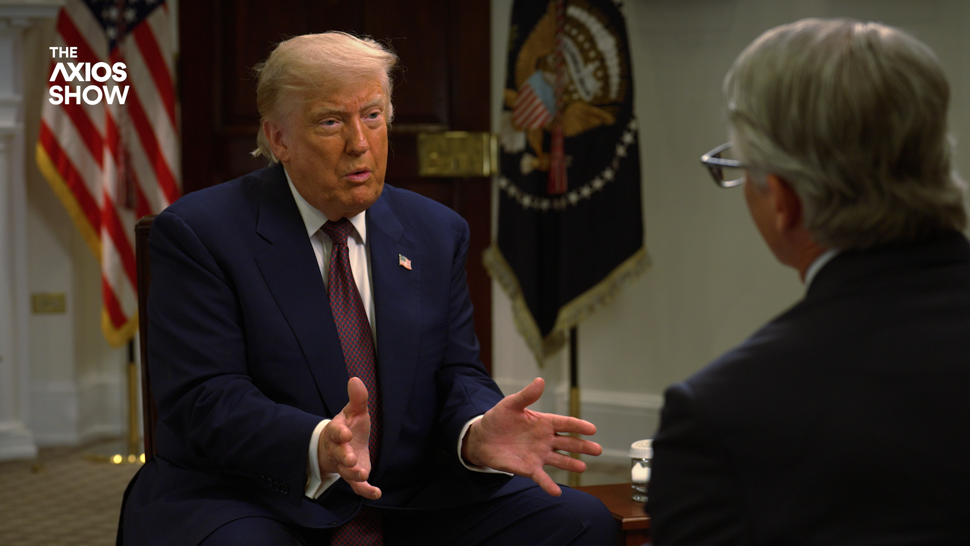 President Trump gestures as he talks to Marc Caputo