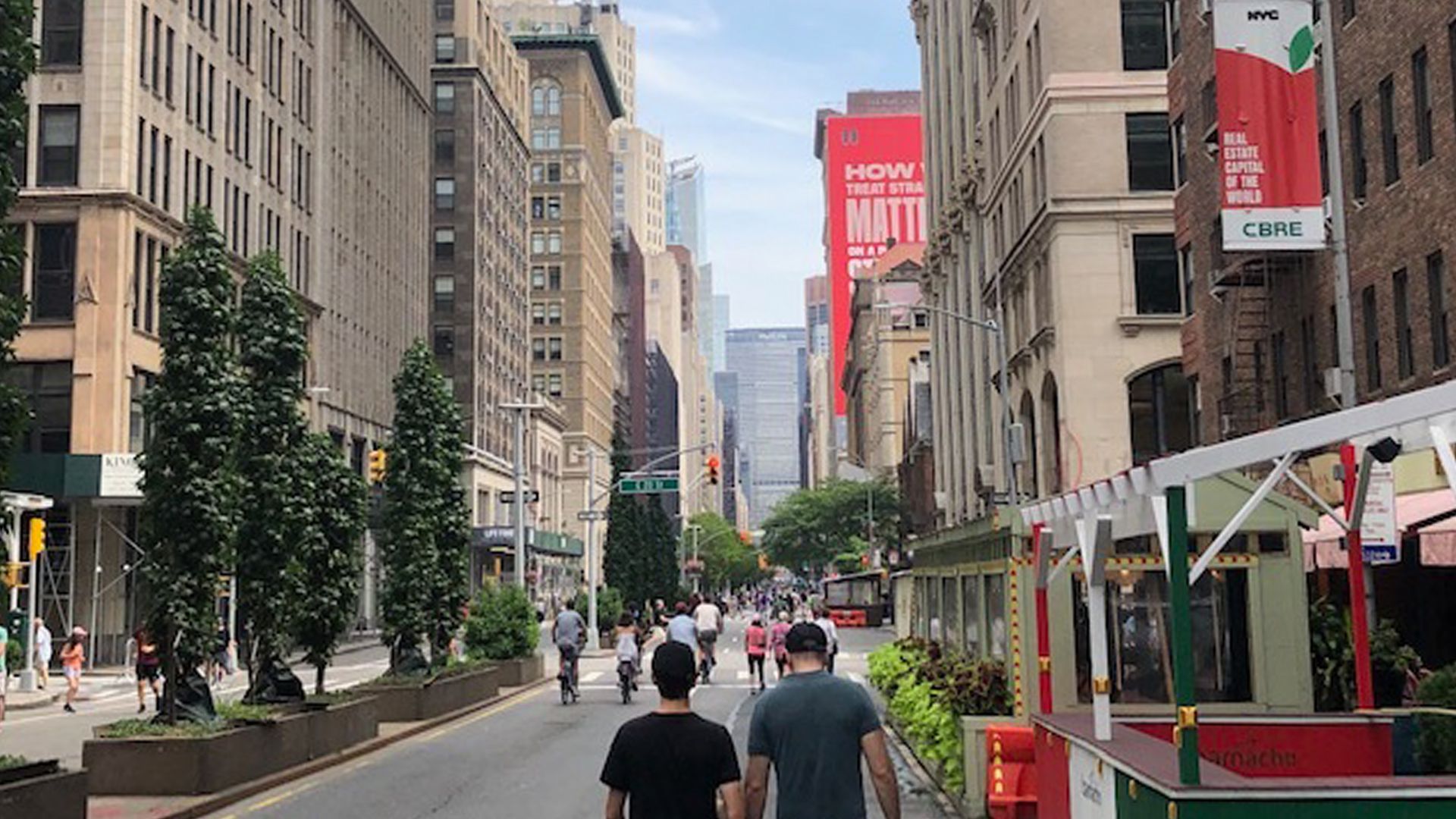 People walking in the middle of Park Avenue on a car-free afternoon in Manhattan.