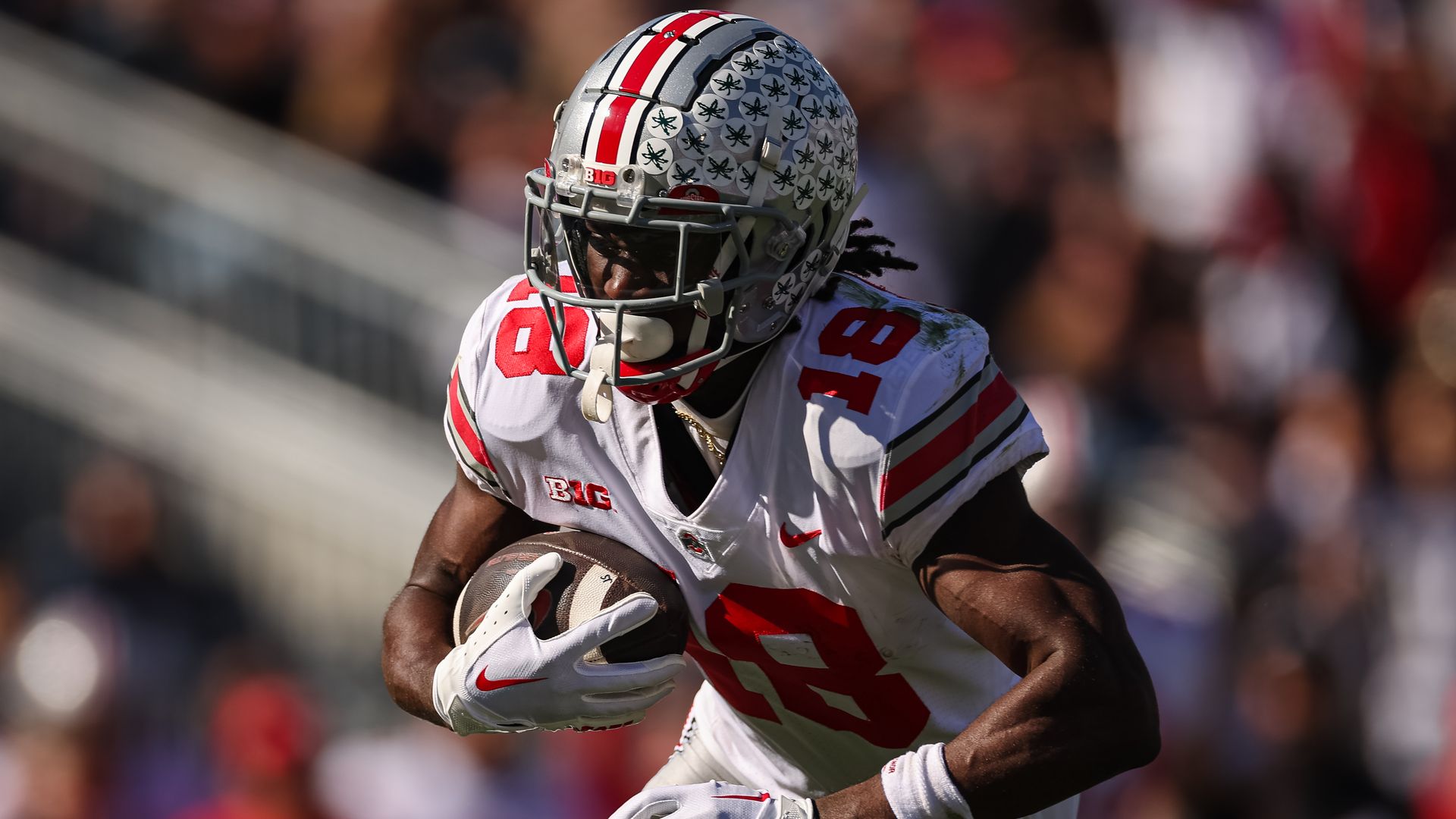 OSU receiver Marvin Harrison Jr., No. 18, carries the football