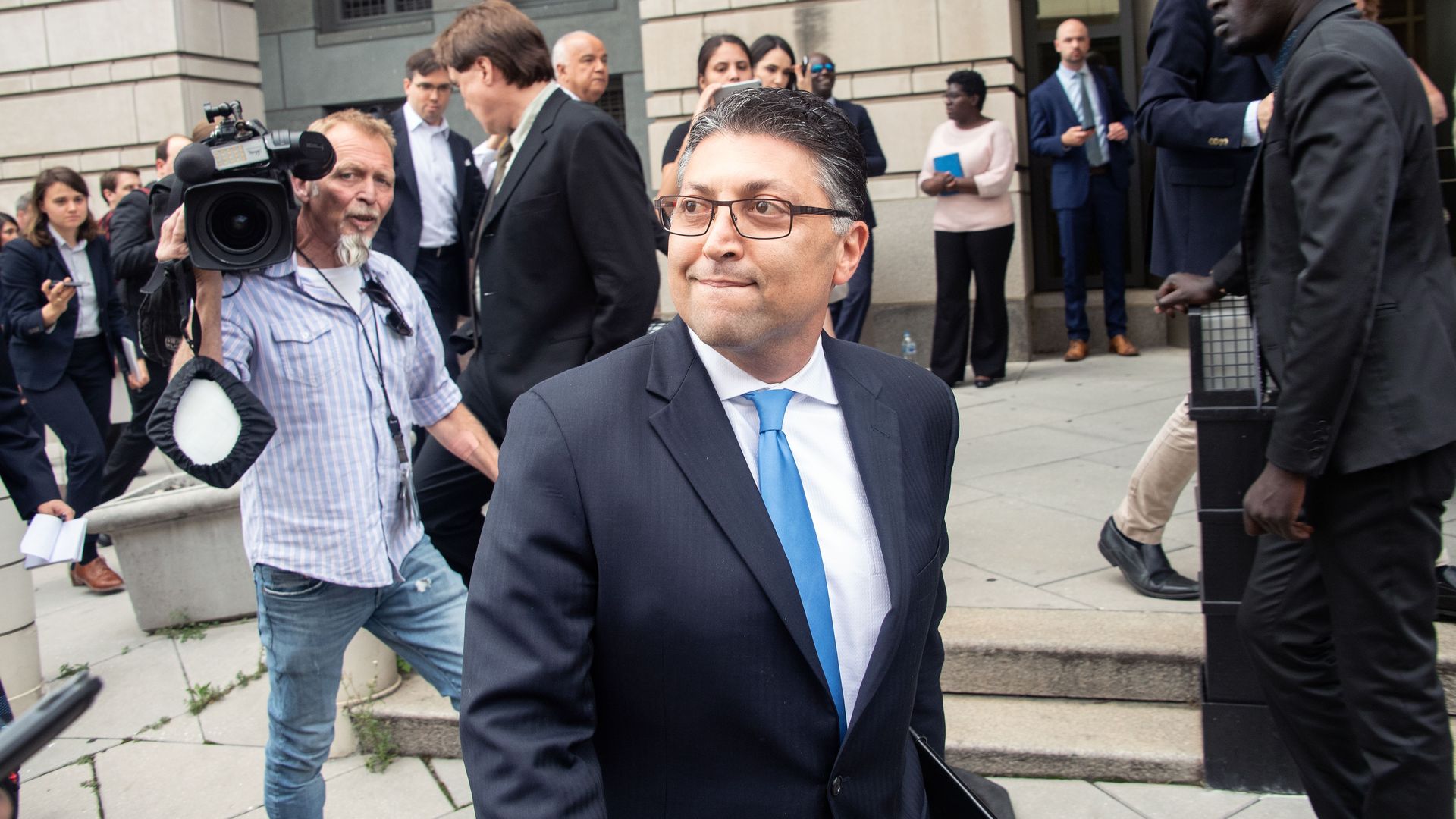 U.S. antitrust chief Makan Delrahim, standing outside a courthouse.