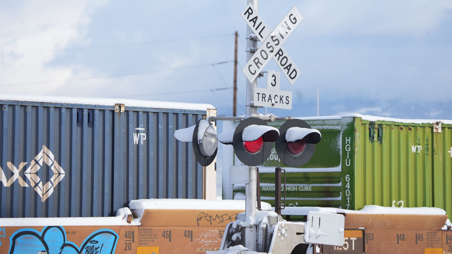 Railcars with cargo containers pass through the Union Pacific Intermodal rail terminal in Salt Lake City, Utah, US, on Friday, Dec. 2, 2022. 