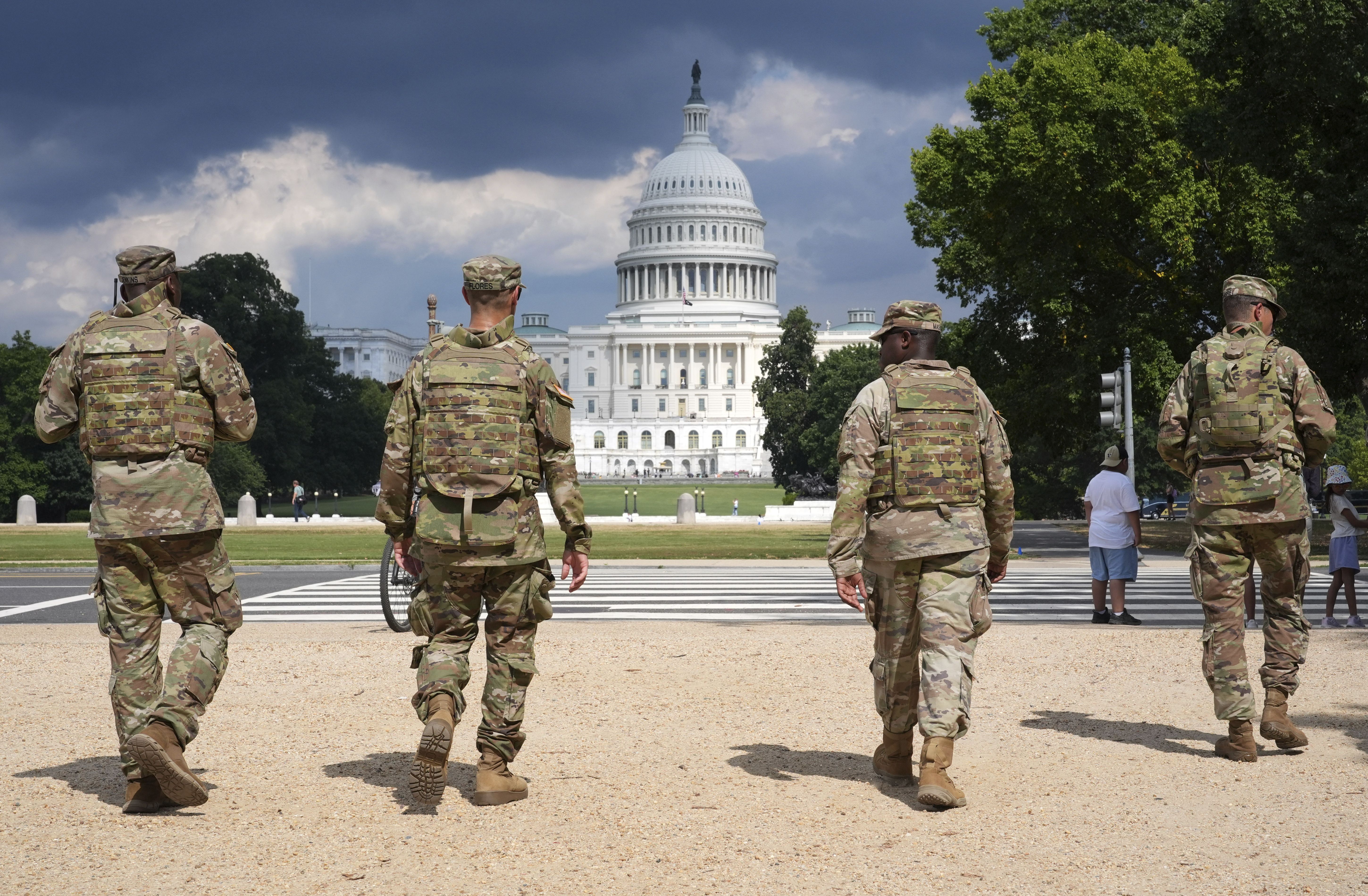 District of Columbia National Guard soldiers patrol on the National Mall, Thursday, August 14, 2025, in Washington. The U.S. Capitol is seen in the distance. Photo: Jacquelyn Martin/AP