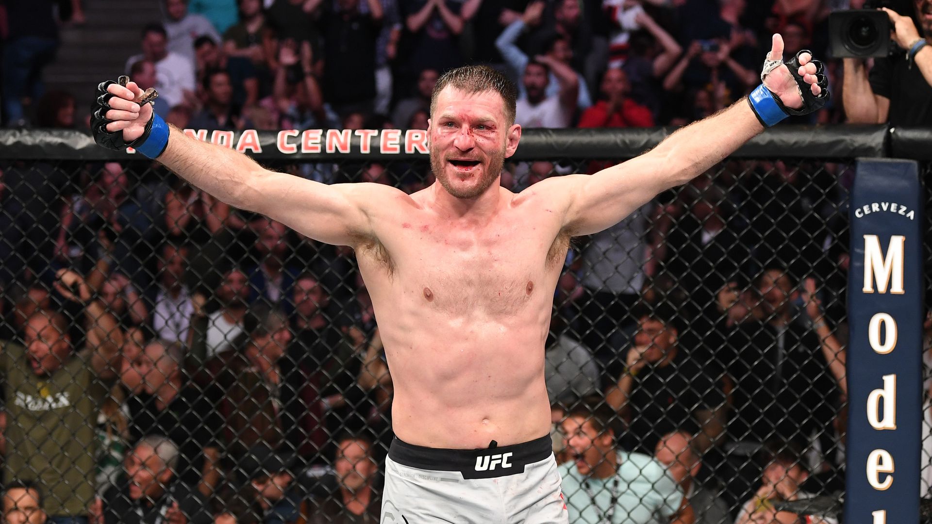 Stipe Miocic raises his arms after a fight. 