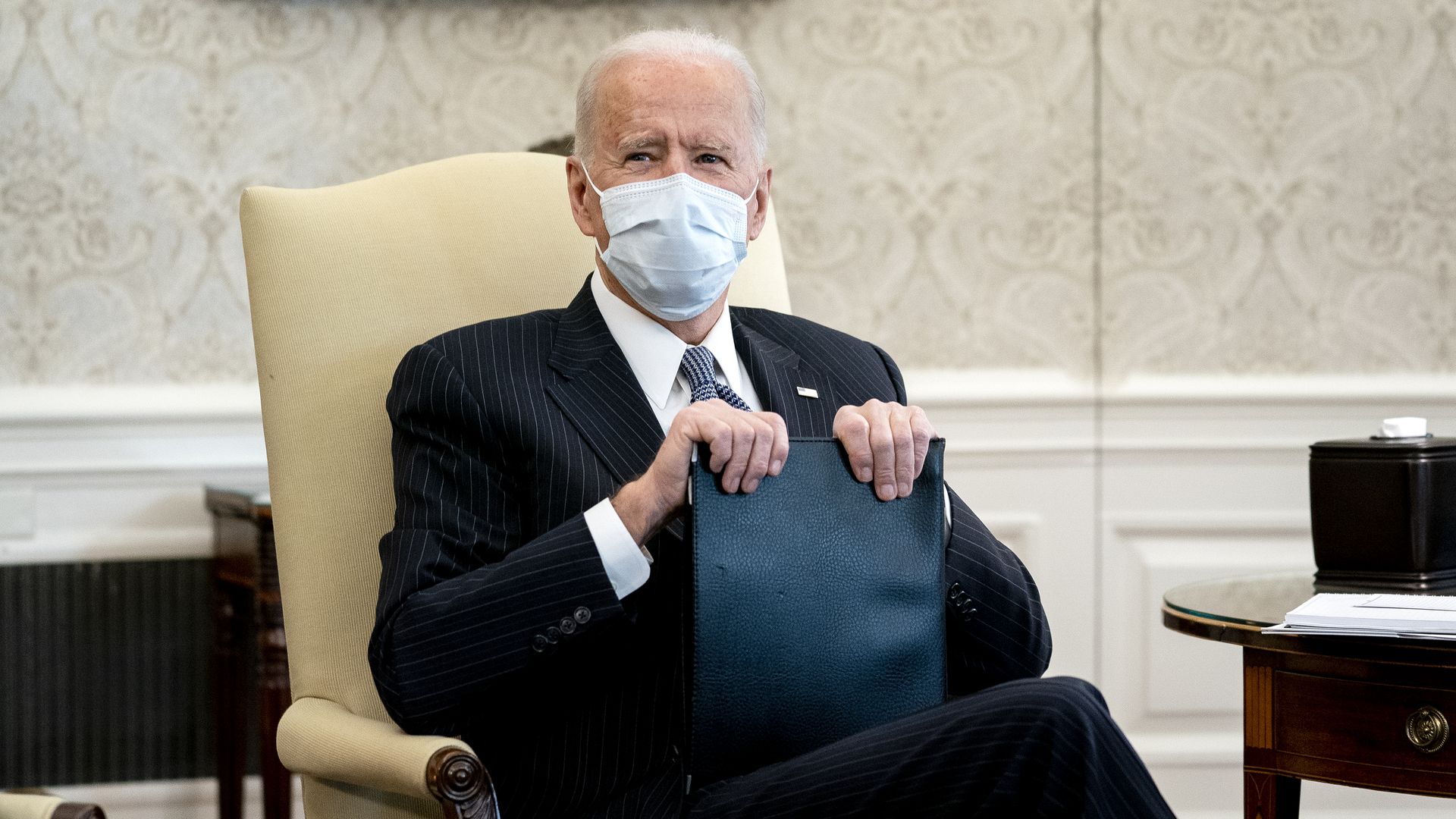 President Joe Biden wears a protective mask while meeting with Democratic senators in the Oval Office of the White House in Washington, D.C., U.S., on Wednesday, Feb. 3