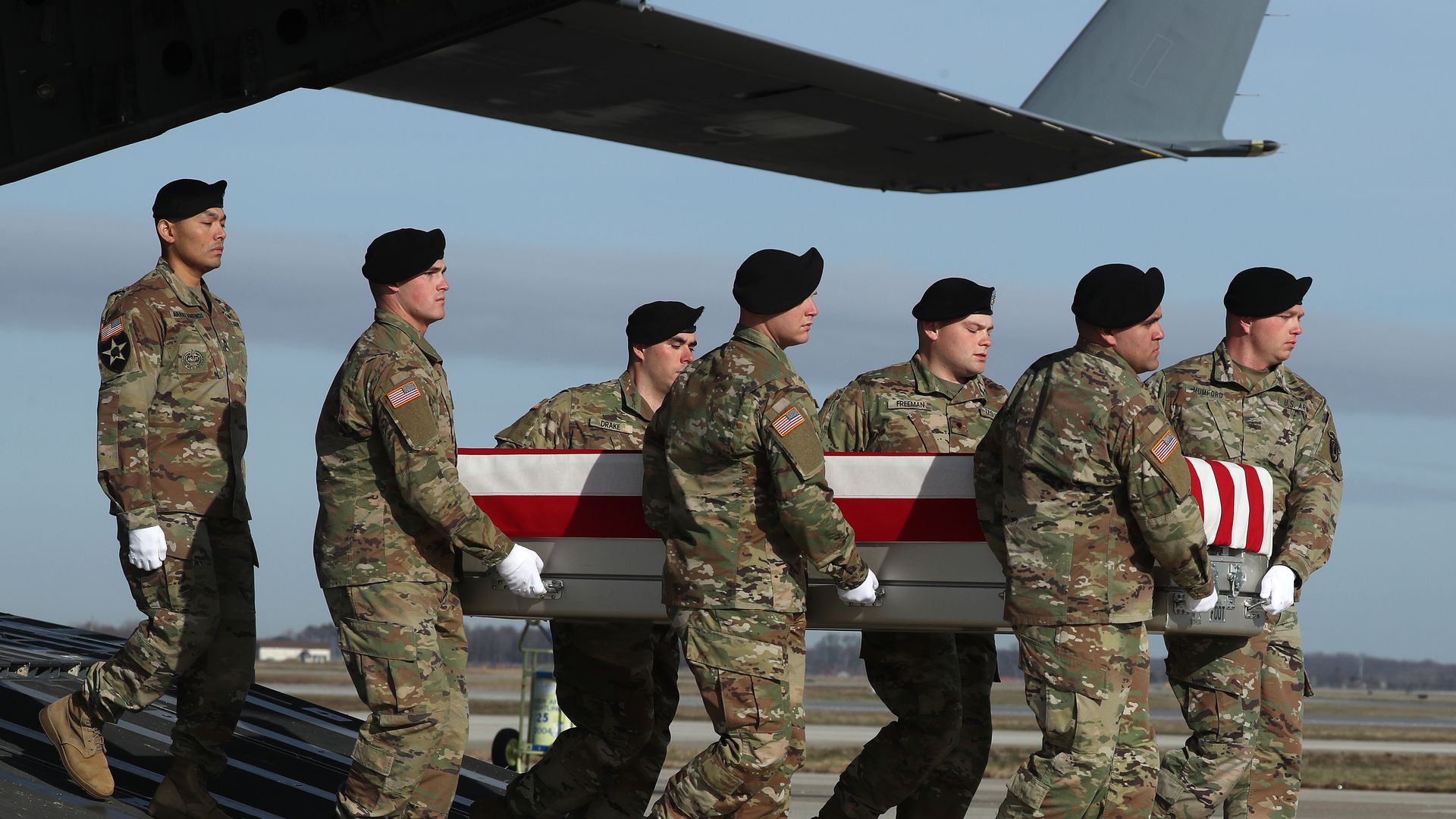 U.S. Army carry team moves the transfer case containing remains of U.S. Army Sgt. 1st Class Michael Goble.