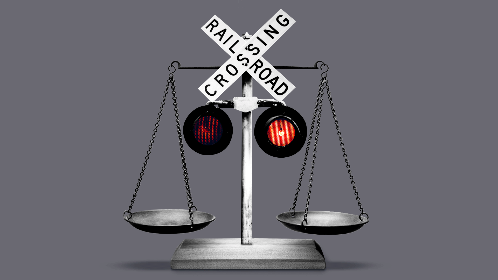 Animated illustration of scales with railroad crossing lights blinking