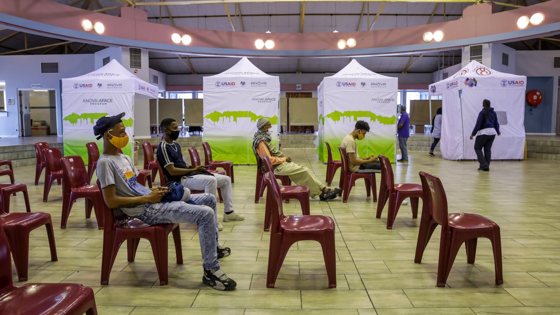Residents wait at the Grassy Park civic center vaccination point in Cape Town, South Africa, on Tuesday, Nov. 30, 2021.