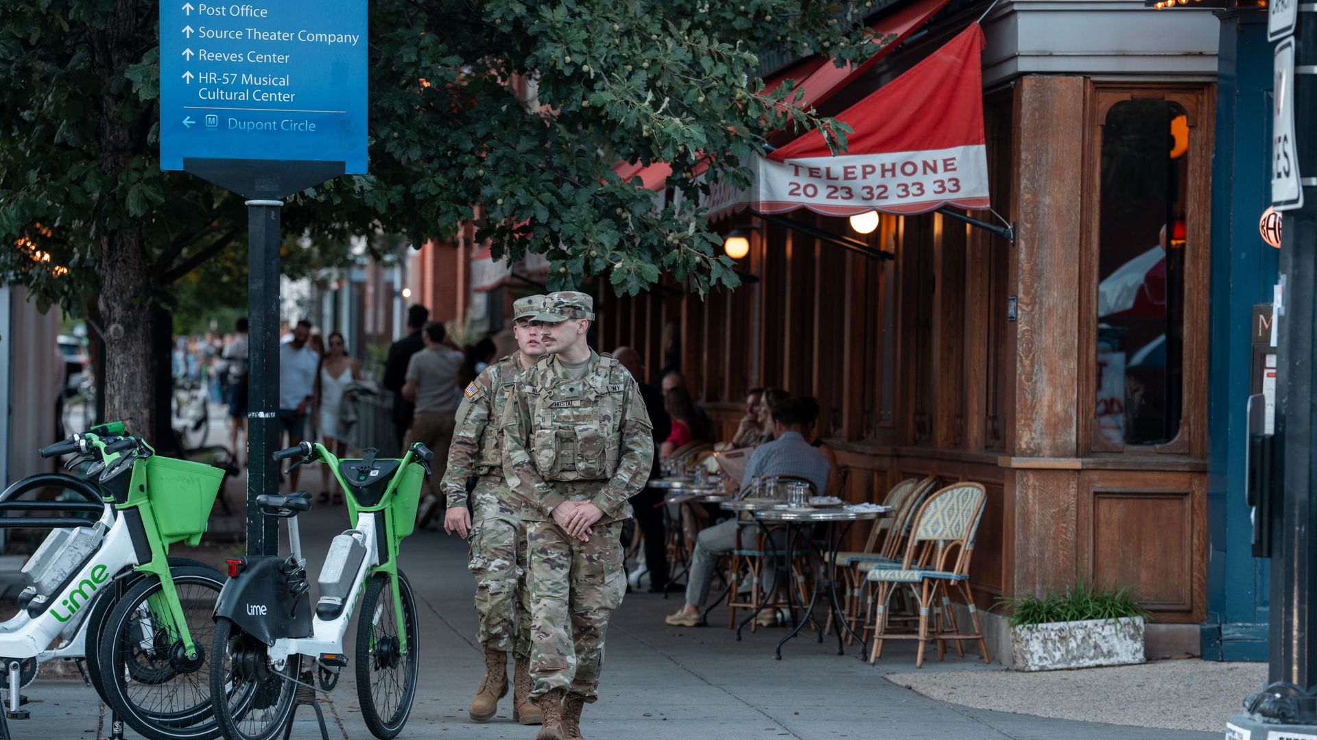National Guard soldiers walk by a restaurant in D.C.