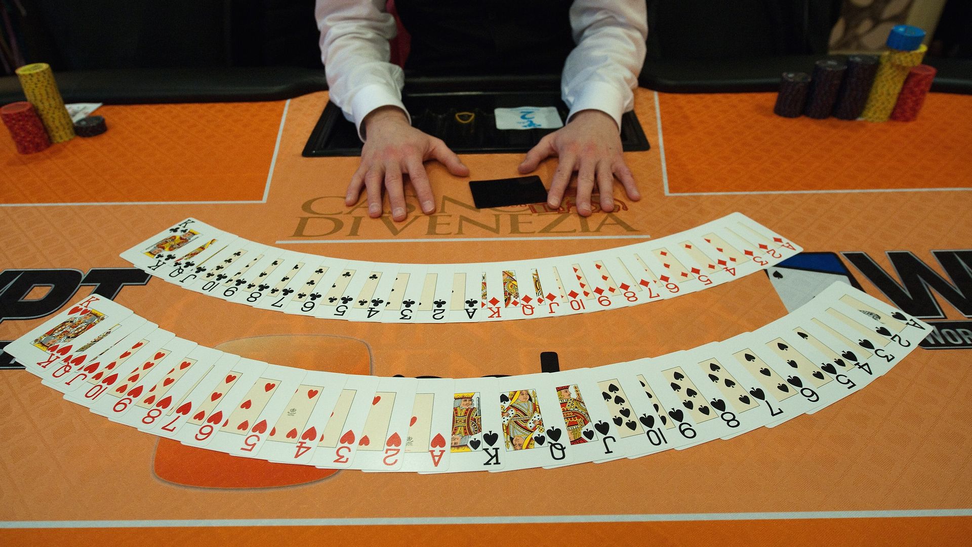 A Croupier shows poker cards during the opening of the World Poker Tour (WPT) tournament.