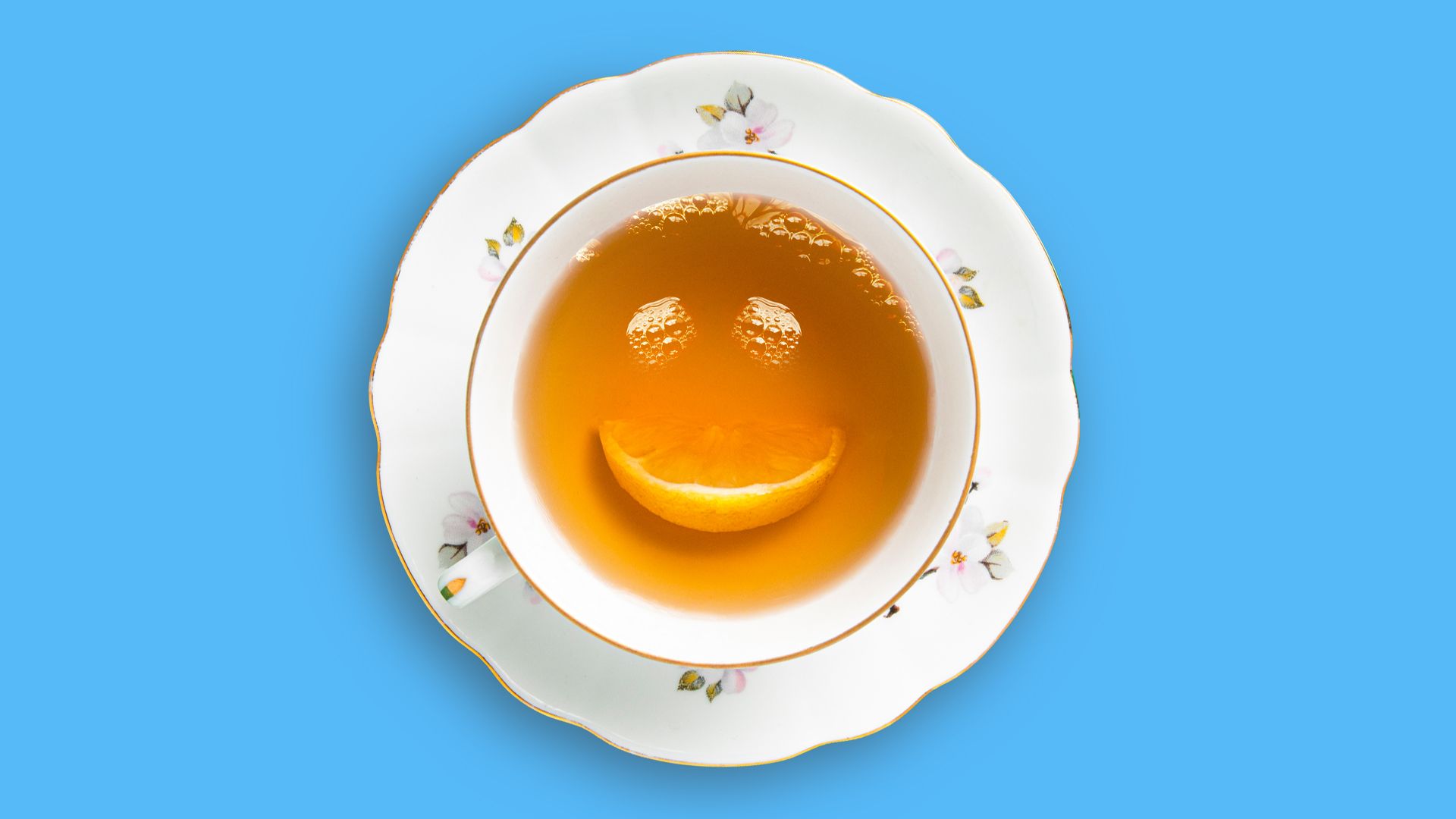Illustration of a tea cup with bubbles and a lemon slice creating a smiley face