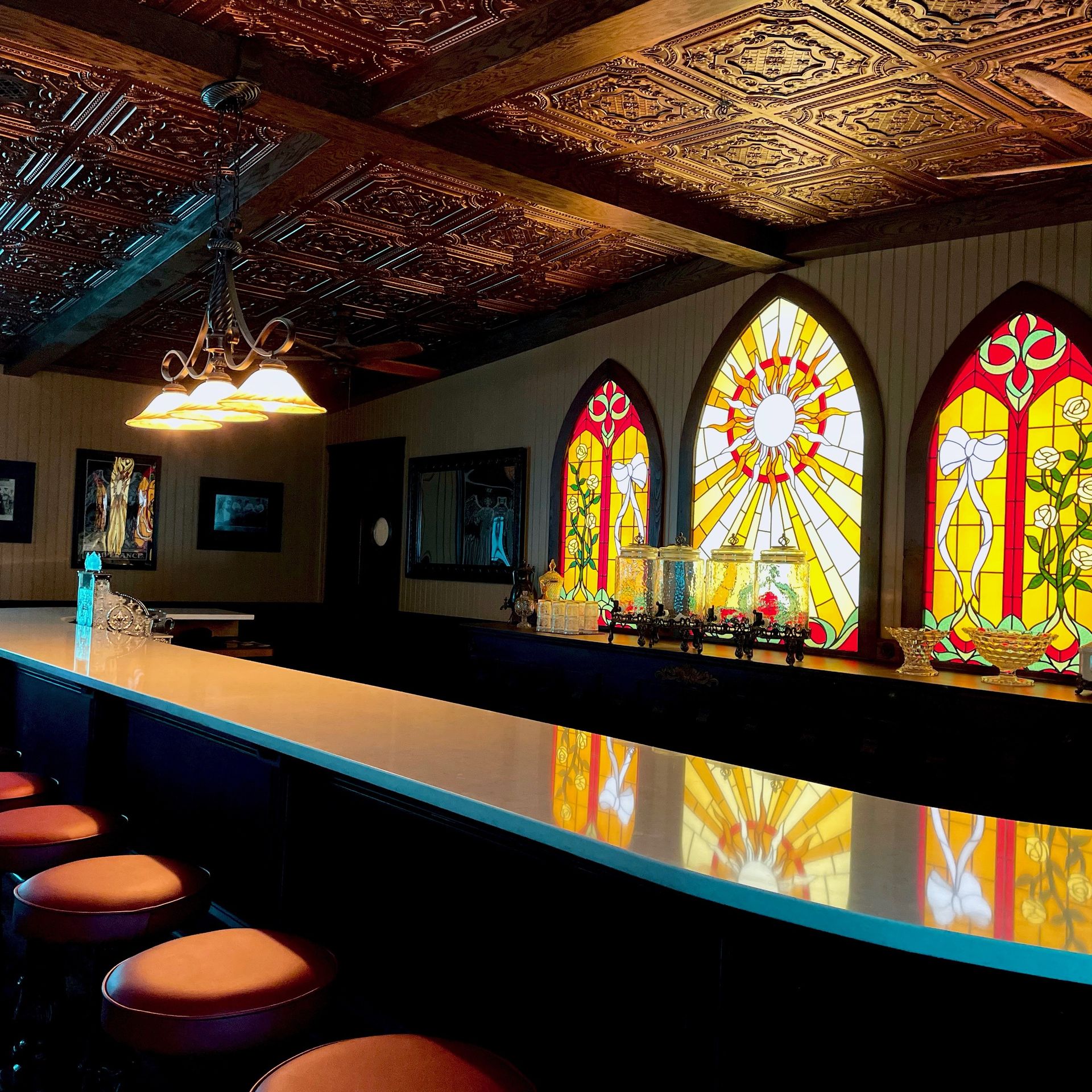A bar with bright stained glass.