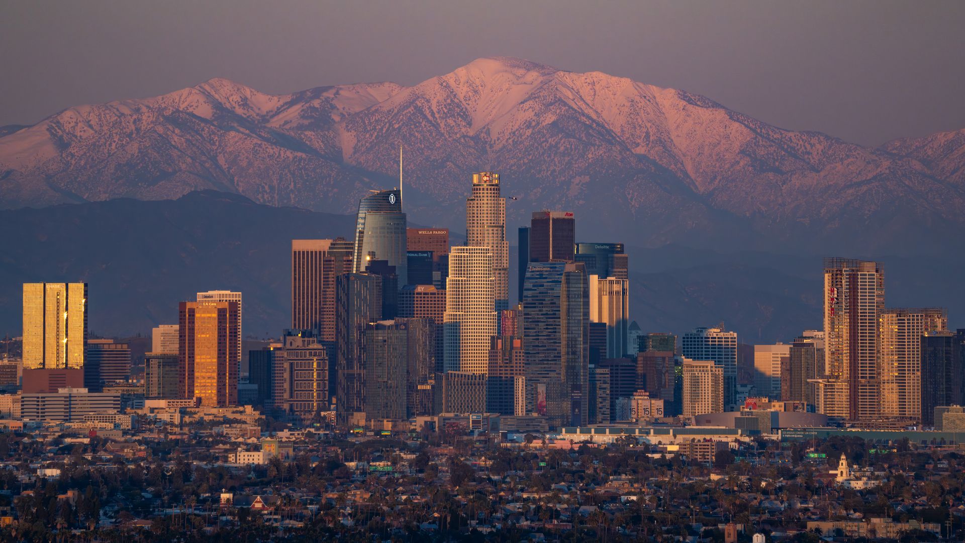 LOS ANGELES, CA - FEBRUARY 11: General views of the downtown Los Angeles skyline against the snowy San Gabriel Mountains after a recent winter storm system passes on February 11, 2024 in Los Angeles, California. (Photo by AaronP/Bauer-Griffin/GC Images)