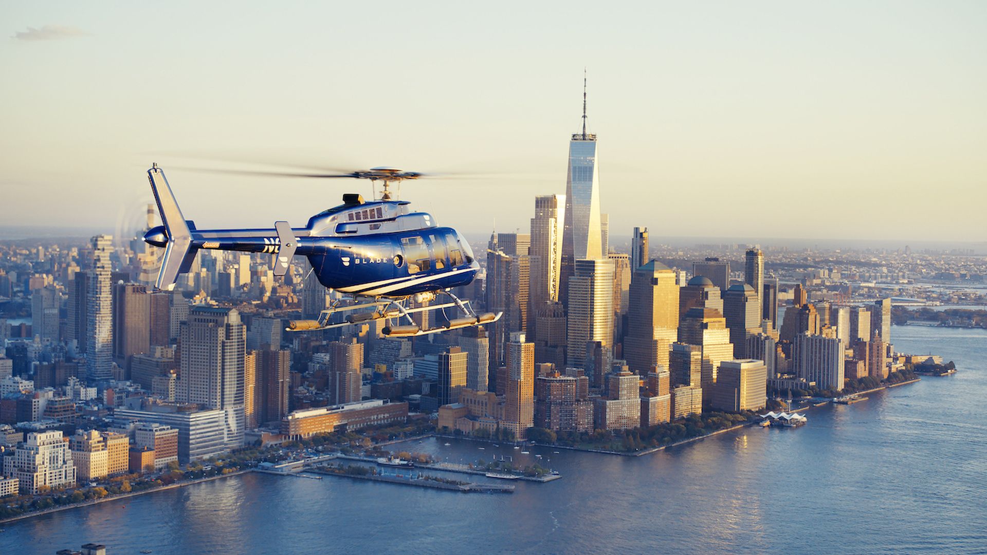 A Blade helicopter flies over Manhattan