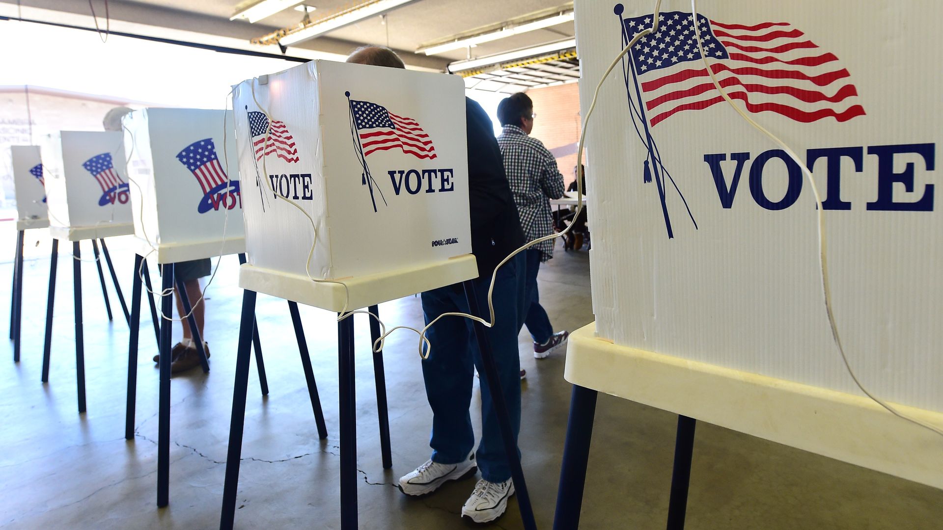 Voters in voting booths