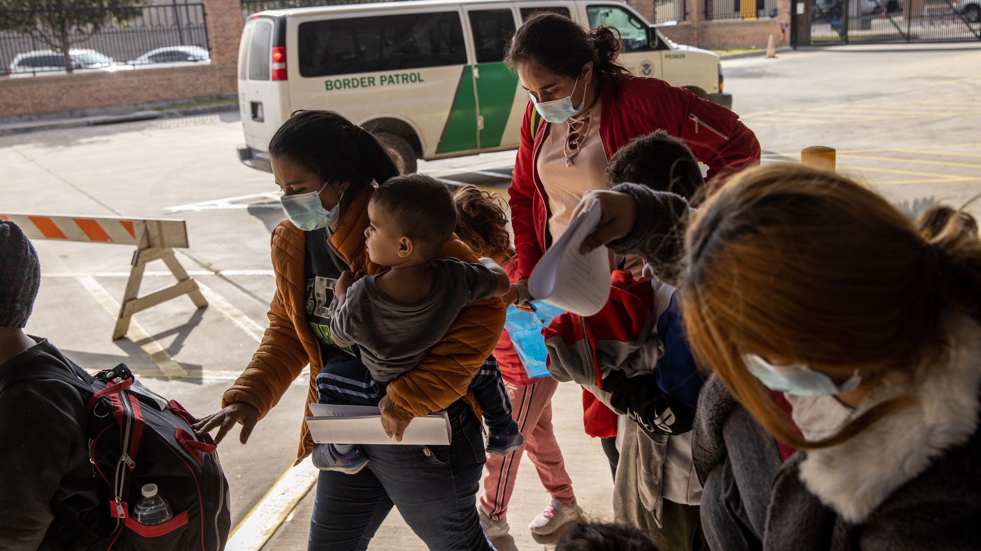 A family of Central American asylum seekers arrives to a bus station after being dropped off by U.S. Border Patrol agents on February 25, 2021 in Brownsville, Texas. 
