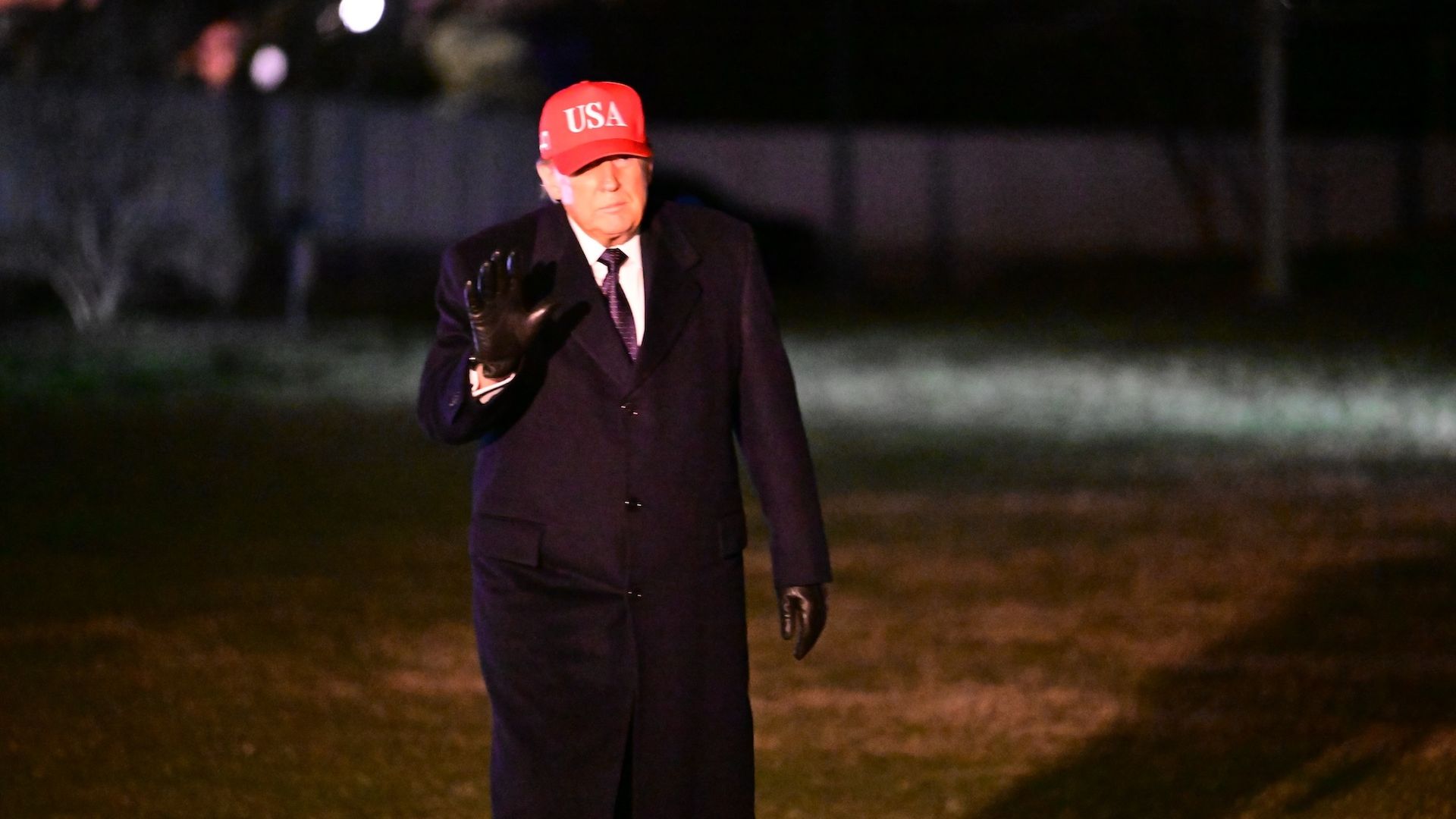 Trump walks on the South Lawn of the White House after arriving on Marine One