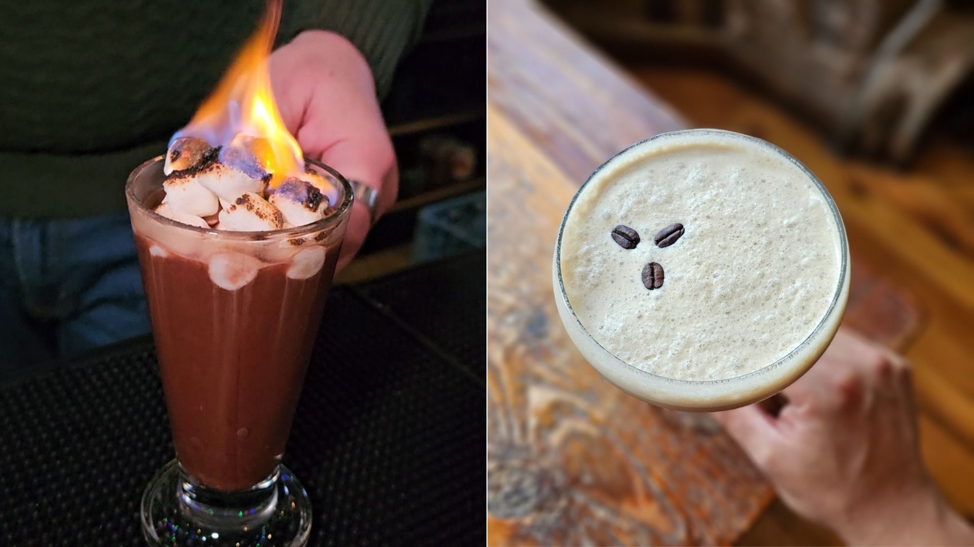Left: Hand holding a tall glass of hot chocolate topped with marshmallows on fire. Right: Hand holding a frothy coffee drink with three coffee beans arranged on top, on a wooden table.