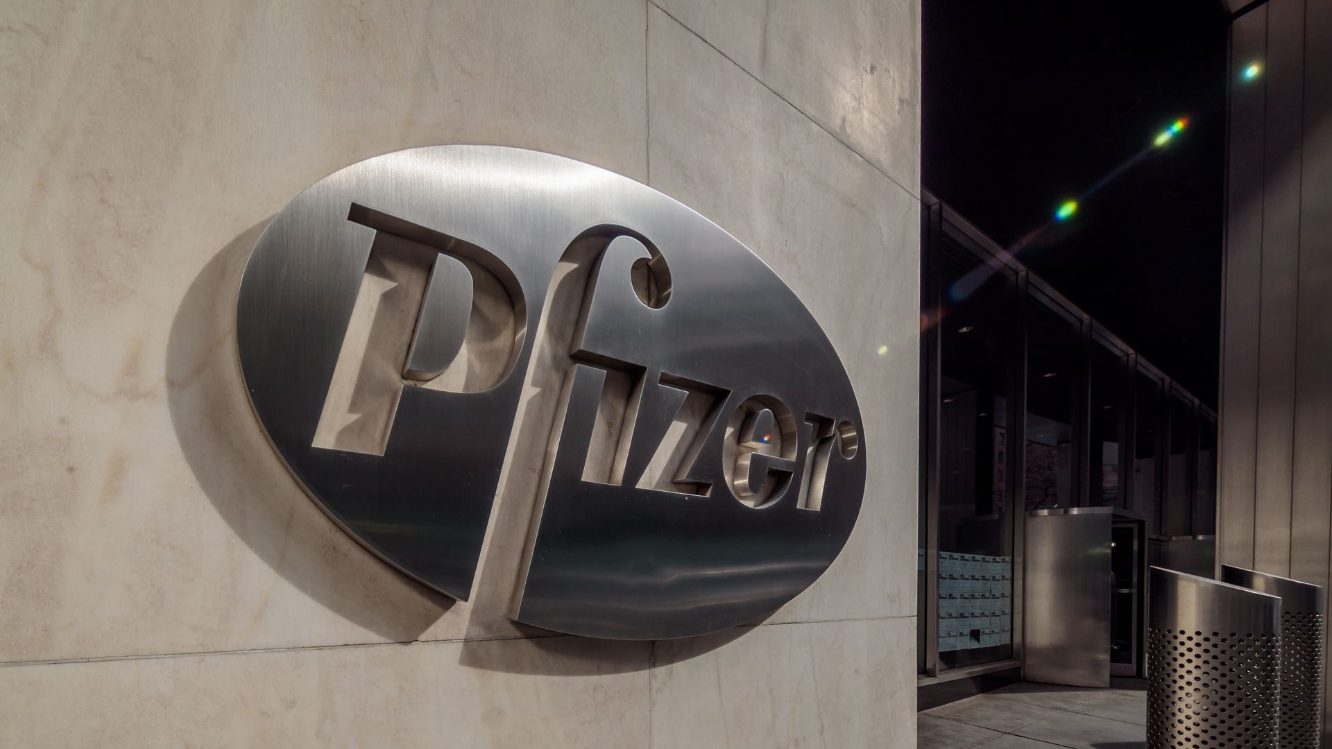 Pfizer's silver logo on a building.