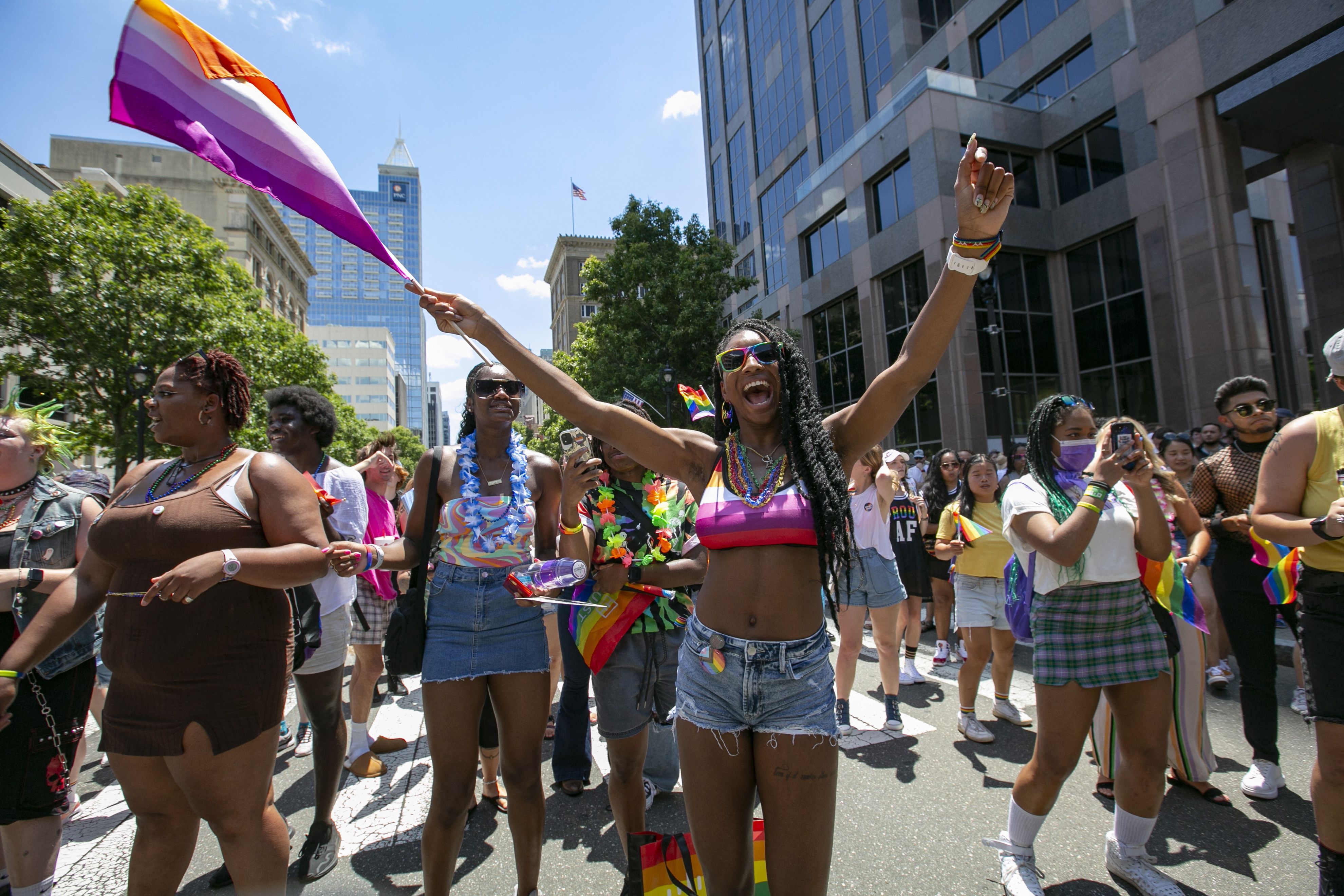 People wave rainbow flags during celebrations for Pride month on June 25, 2022, in Raleigh, North Carolina. 
