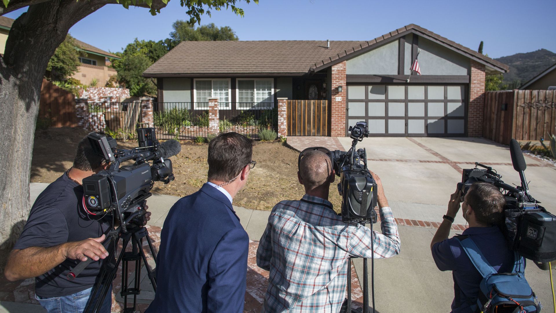 Media crowds outside of suspected California shooter's home.