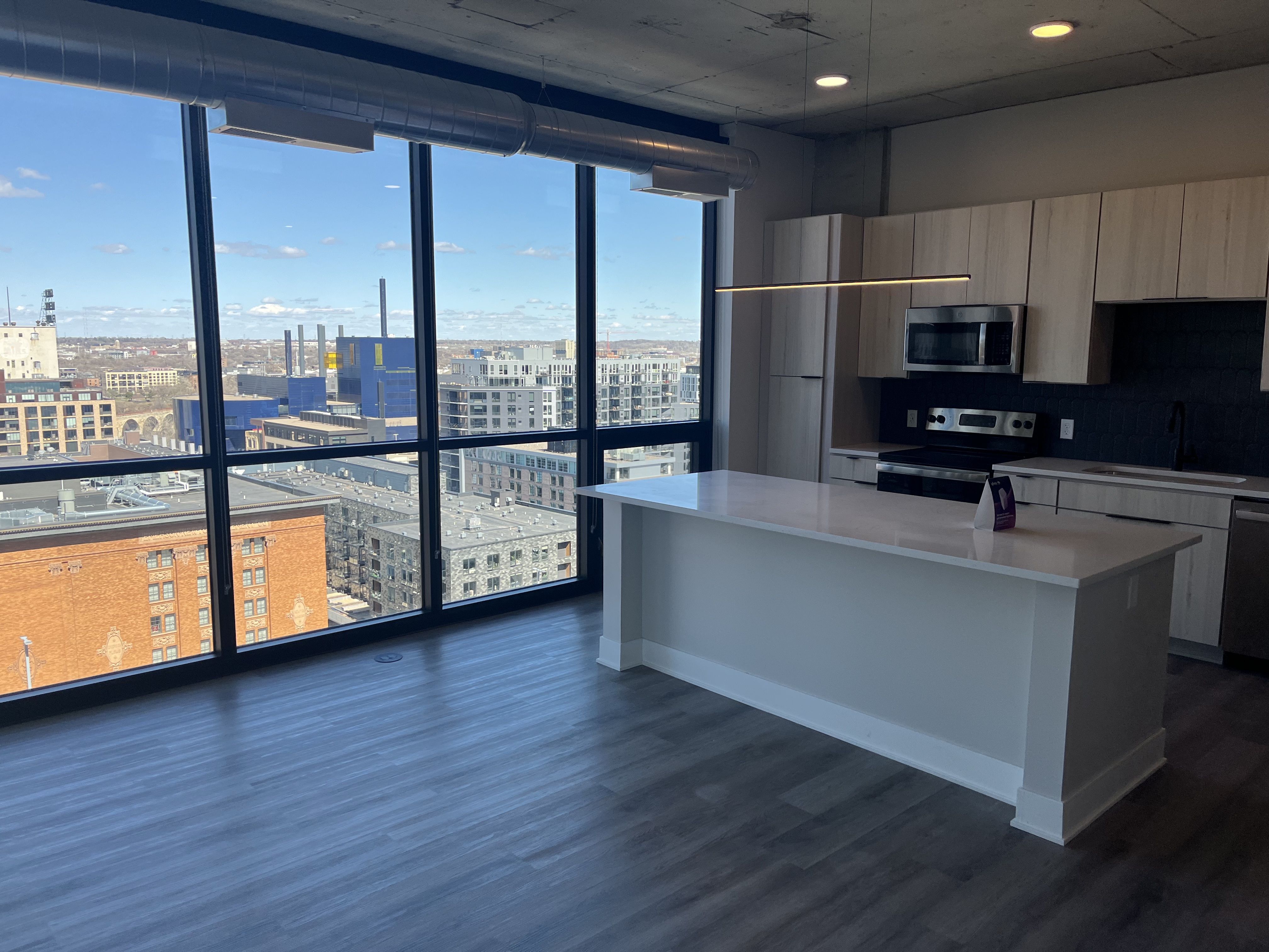 A kitchen with windows looking out on the Guthrie 
