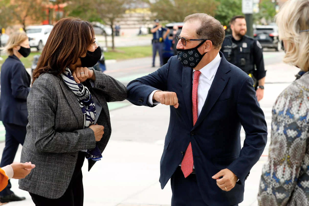 Tellem bumps elbows with Vice President and then-Sen. Kamala Harris in 2020. 
