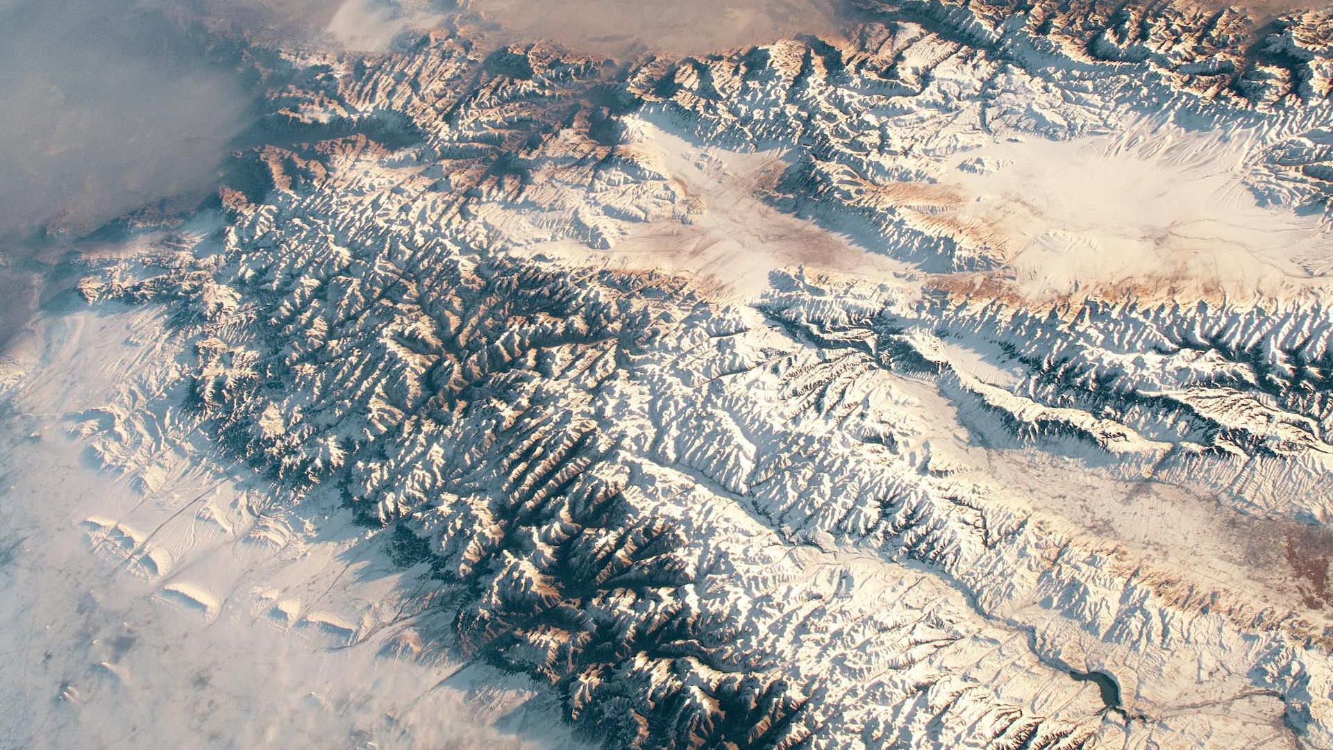 A photo of a mountain range in Asia taken from the International Space Station.