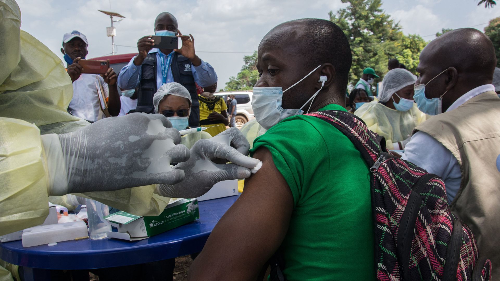 A health care worker giving a patient an anti-Ebola vaccine in Gueckedou, Guinea, in February 2021.