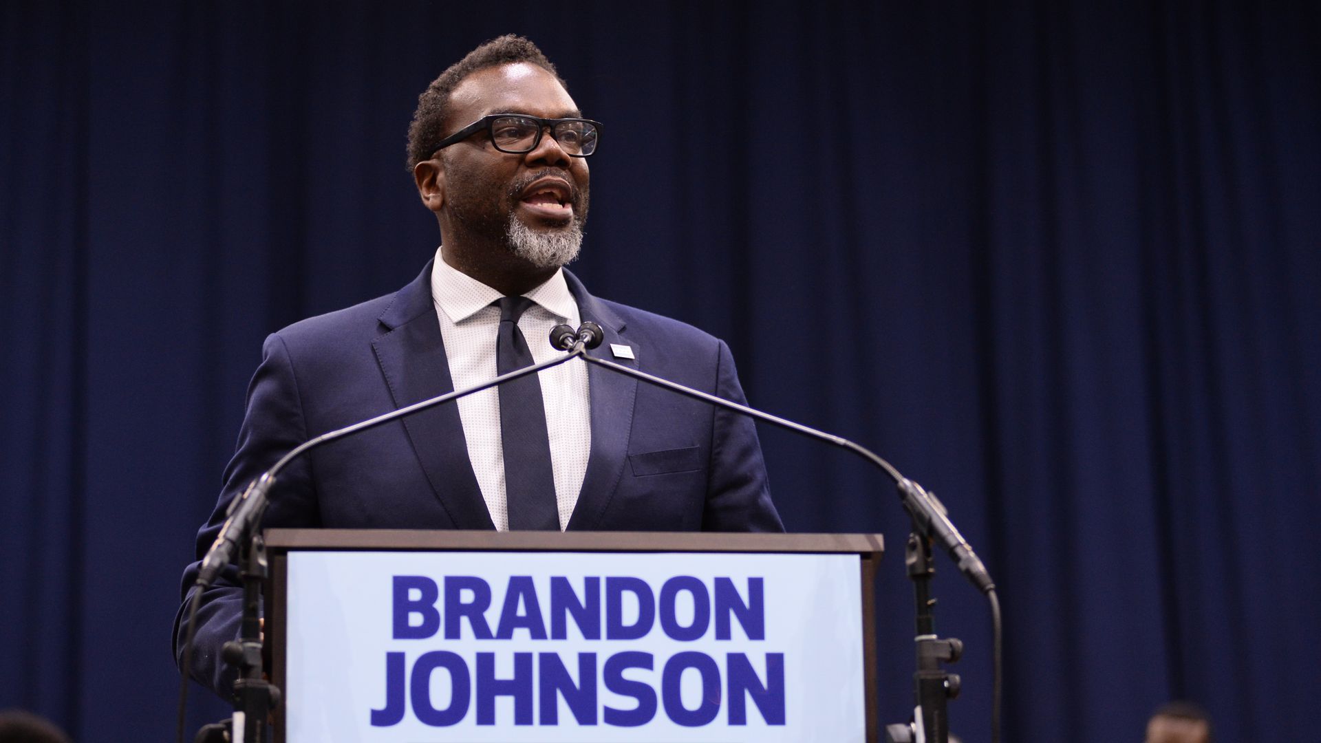 Progressive mayoral candidate Brandon Johnson addresses to crowd at a stadium during a rally in Chicago.