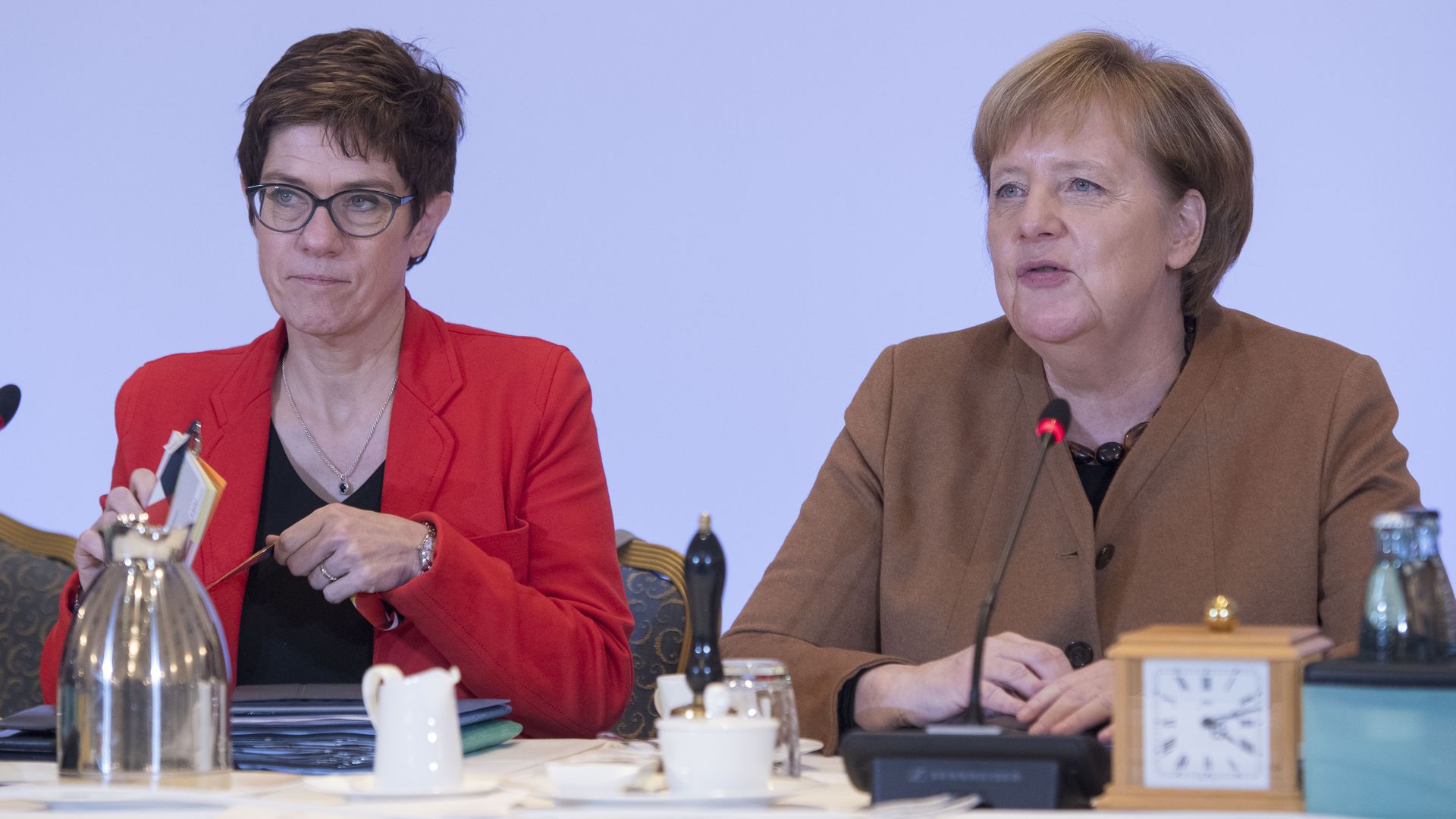 Angela Merkel and AKK seated at a CDU party event