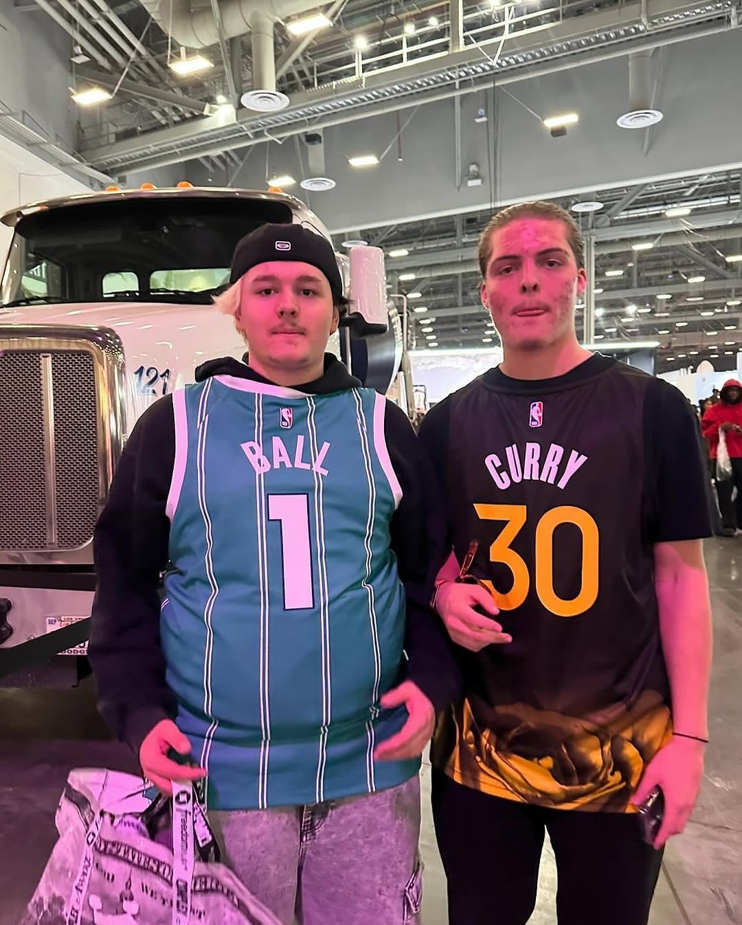 Two attendees of ComplexCon wearing their jersey backwards