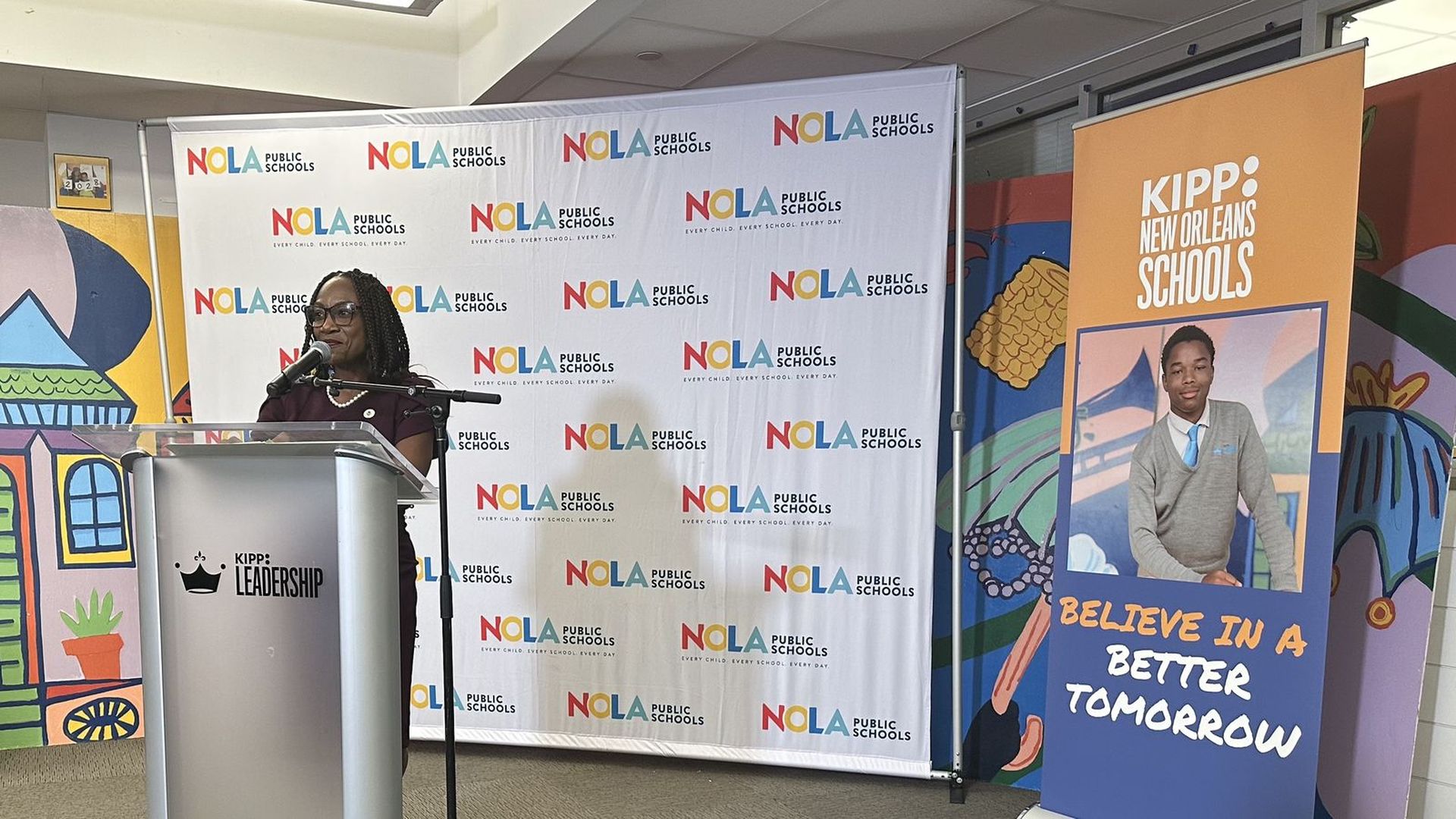 NOLA Public Schools superintendent Avis Williams speaks at a podium.