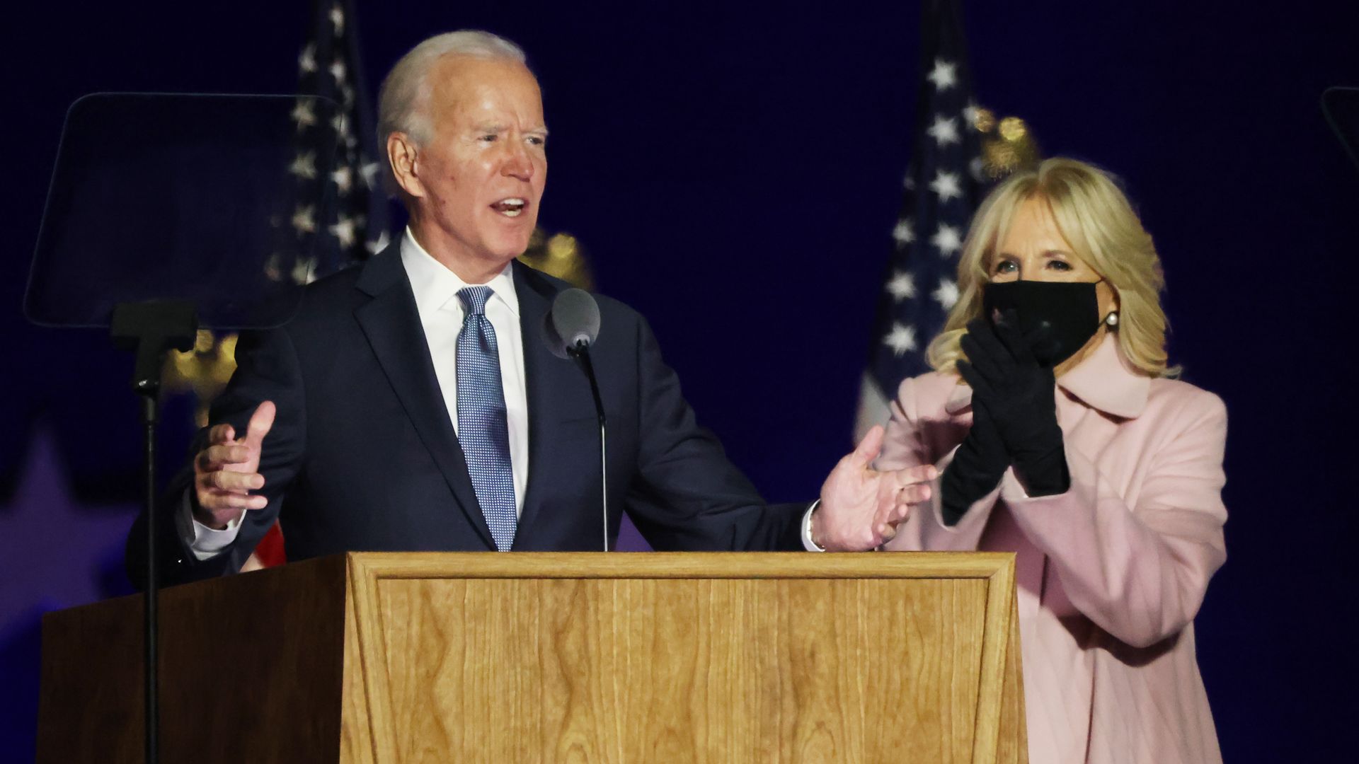 Picture of Joe Biden and his wife, Dr. Jill Biden, in front of a podium