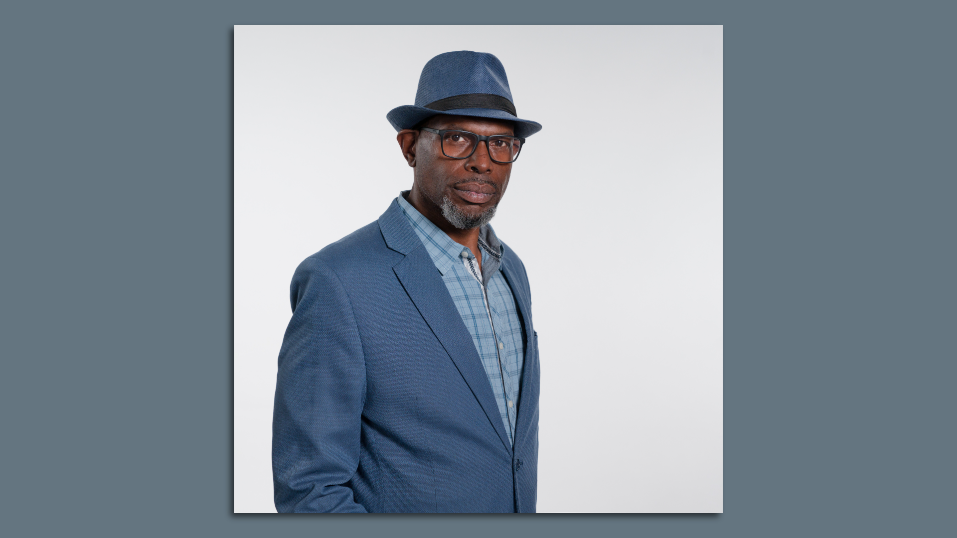Guy in a blue hat and a suit
