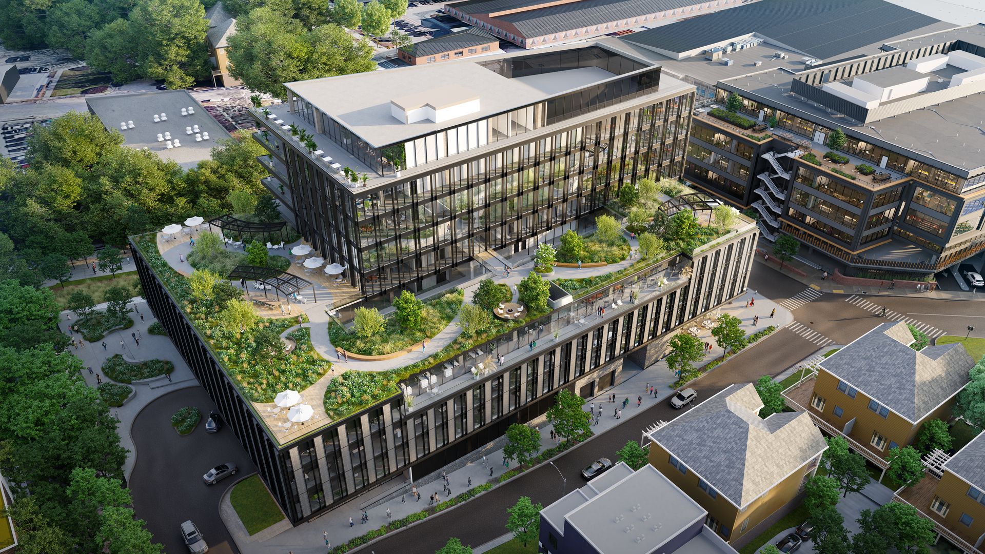 An aerial rendering of a proposed mixed-use project along the Beltline with a green roof