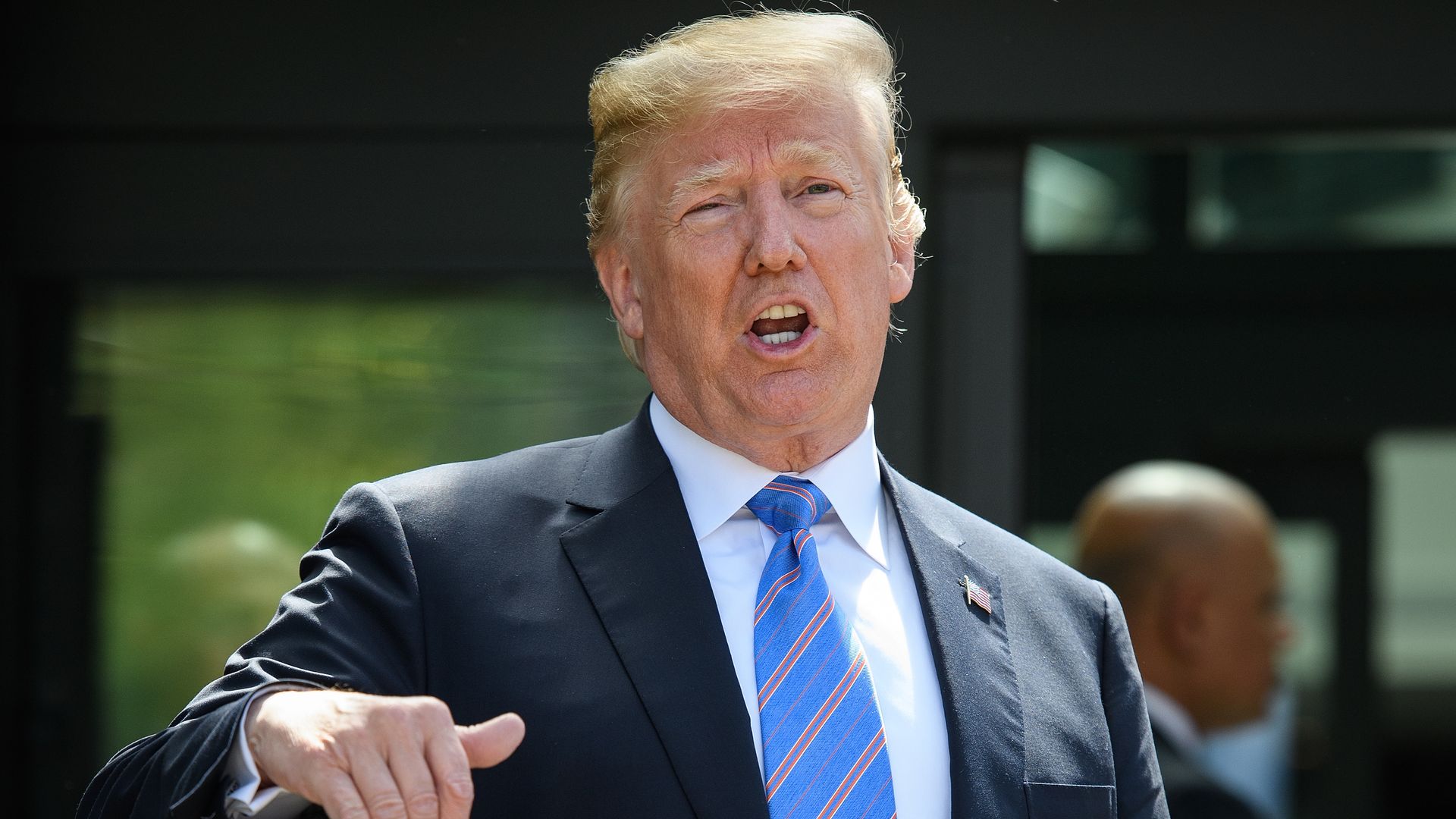 Trump with his hand pointing down