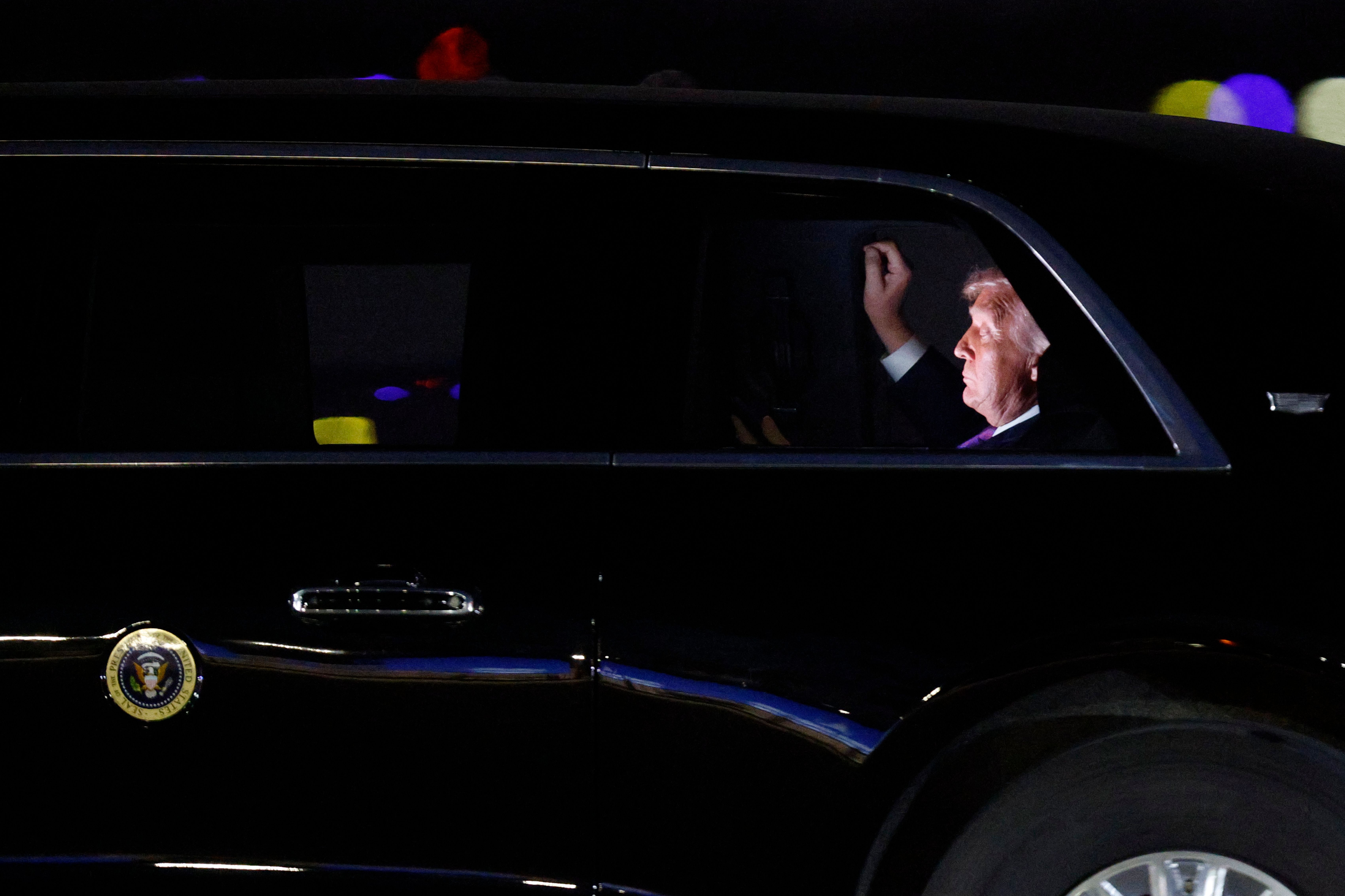 President Donald Trump is seen in his limousine, known as "The Beast," for the motorcade to the White House after his arrival on Air Force One at Joint Base Andrews, Md., Wednesday, March 11, 2026. (AP Photo/Luis M. Alvarez)