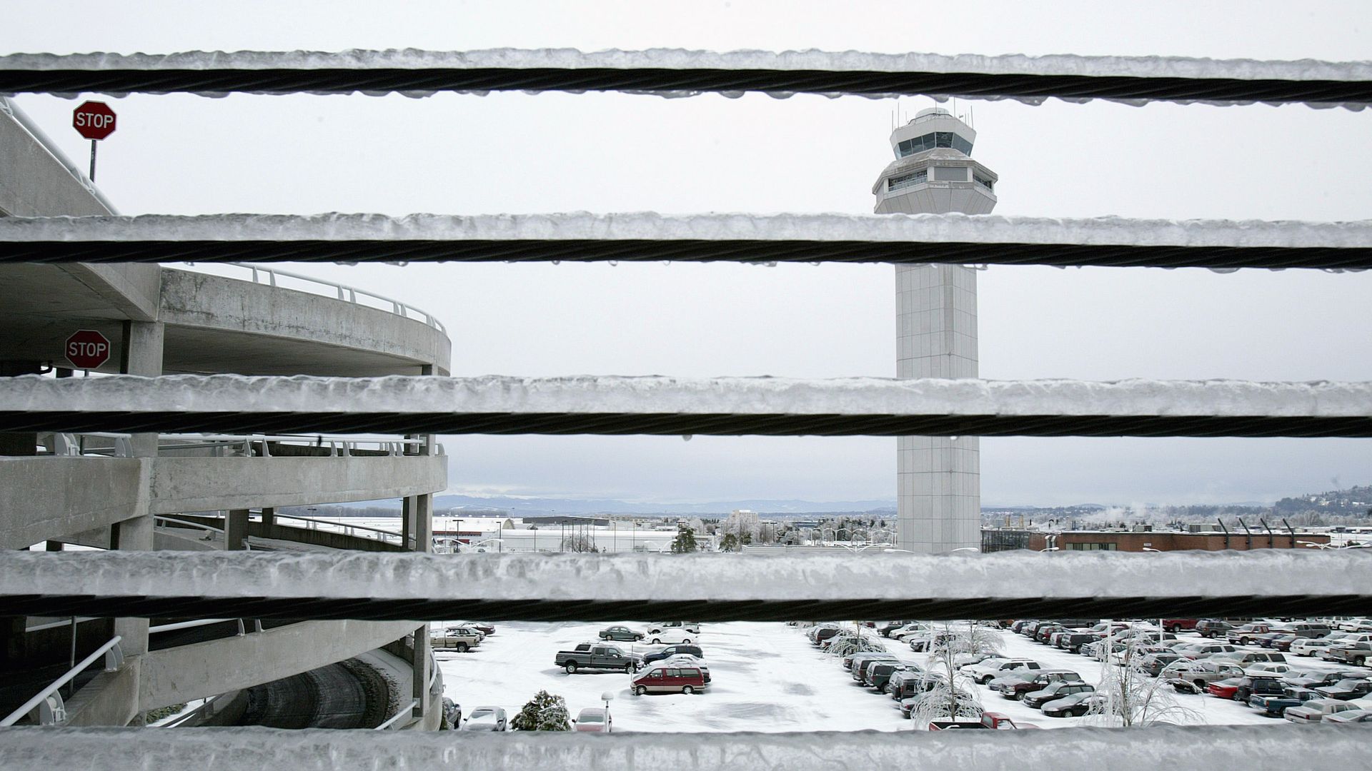 A photo showing a railing with a thick coat of ice. 
