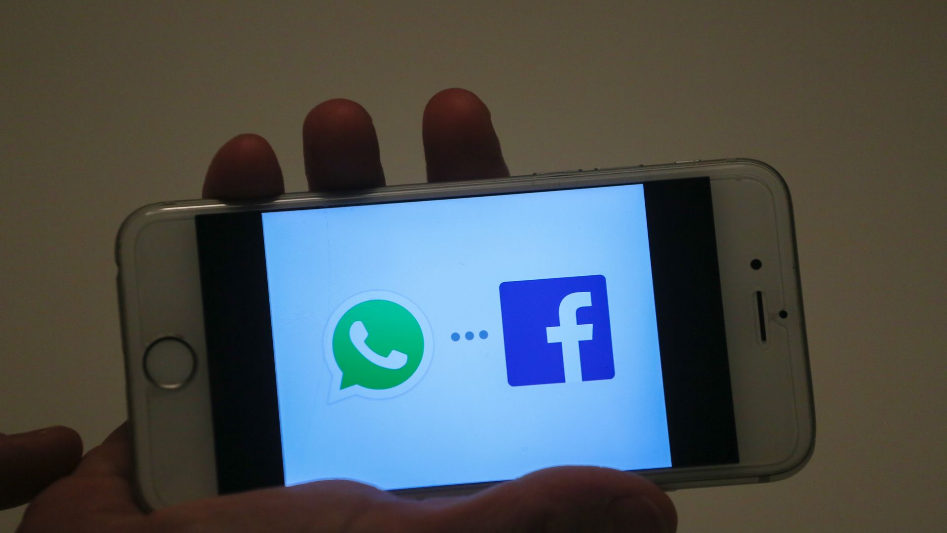 The What's App logo next to Facebook