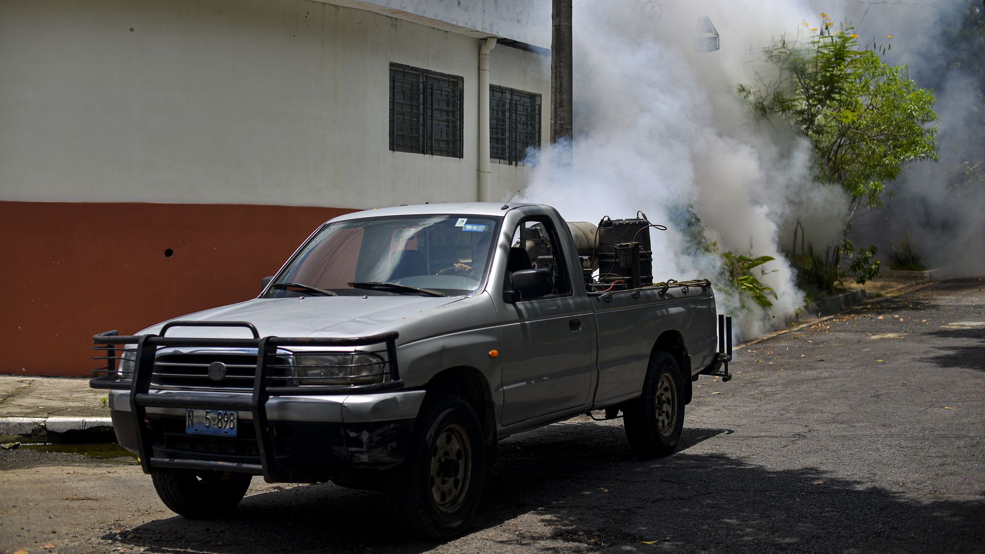 A truck spraying mosquito repellent in San Salvador in August 2020.